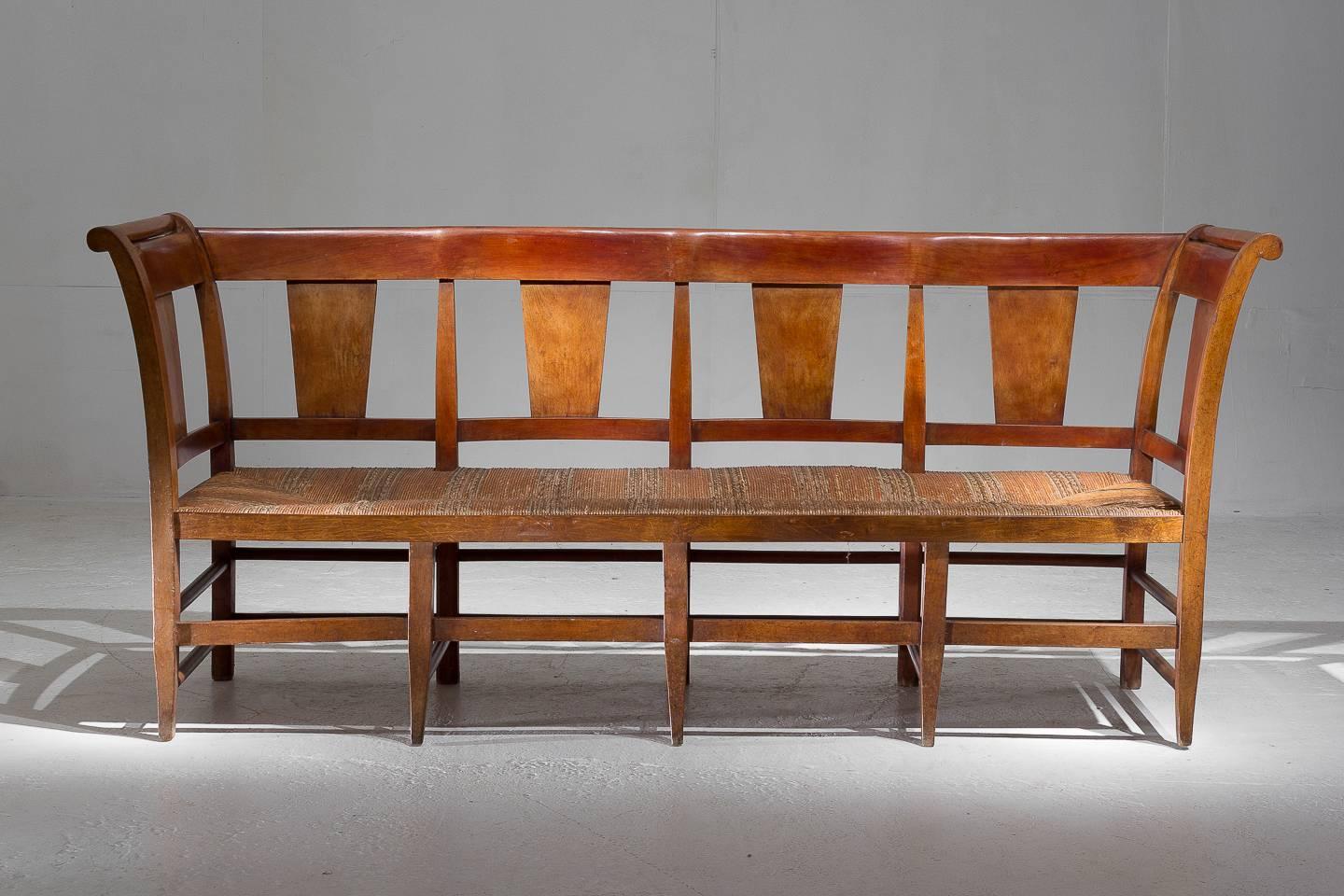 19th century Provençal fruitwood bench with rush seat.

Seat height: 53 cm.