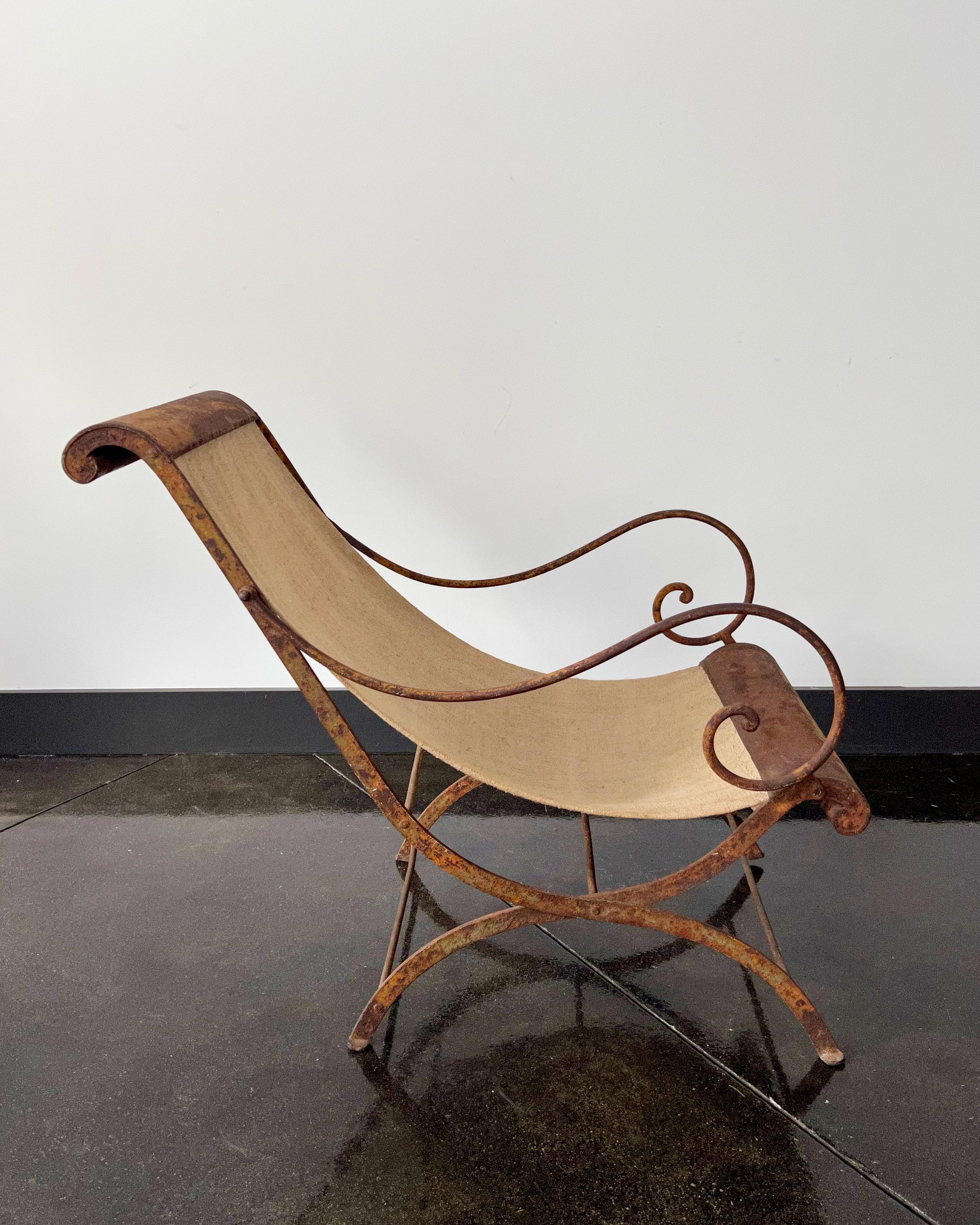 Rare 19th century iron French garden chaise. A delightful piece made of hand-forged iron -now patinated with rust with natural colored antique linen.

 