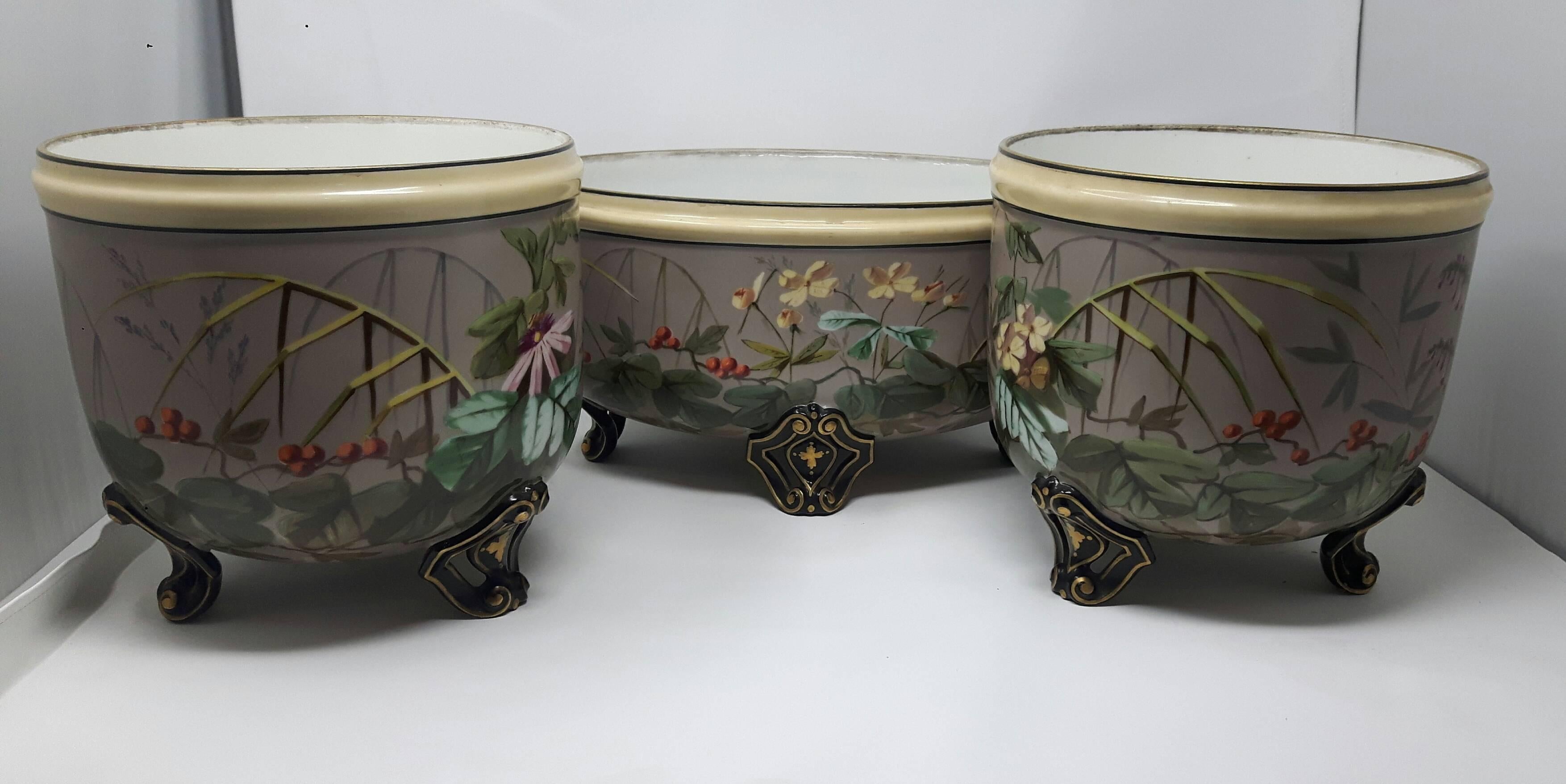 19th century French garniture with a rare platinum ground painted with exotic birds and flowers.