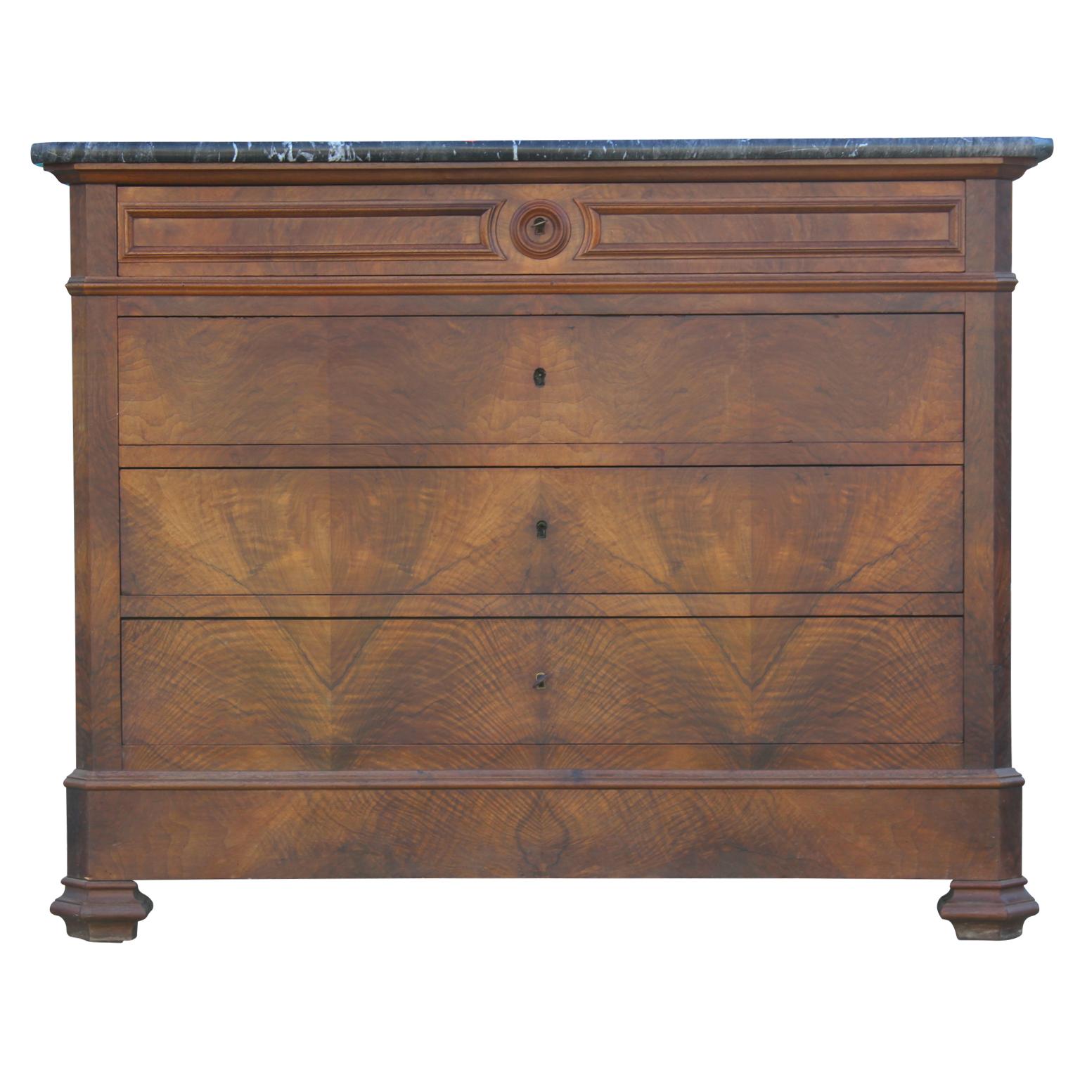 Gorgeous 19th century four-drawer chest of drawers made from a rich walnut with a marble top. George X style.