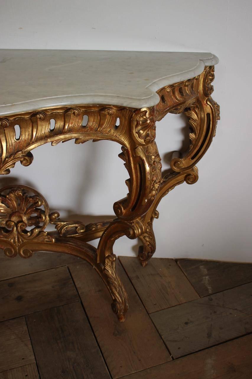 A fine quality and of elegant design and proportions, 19th century French water gilt console table with a marble top, that will work well in most settings.