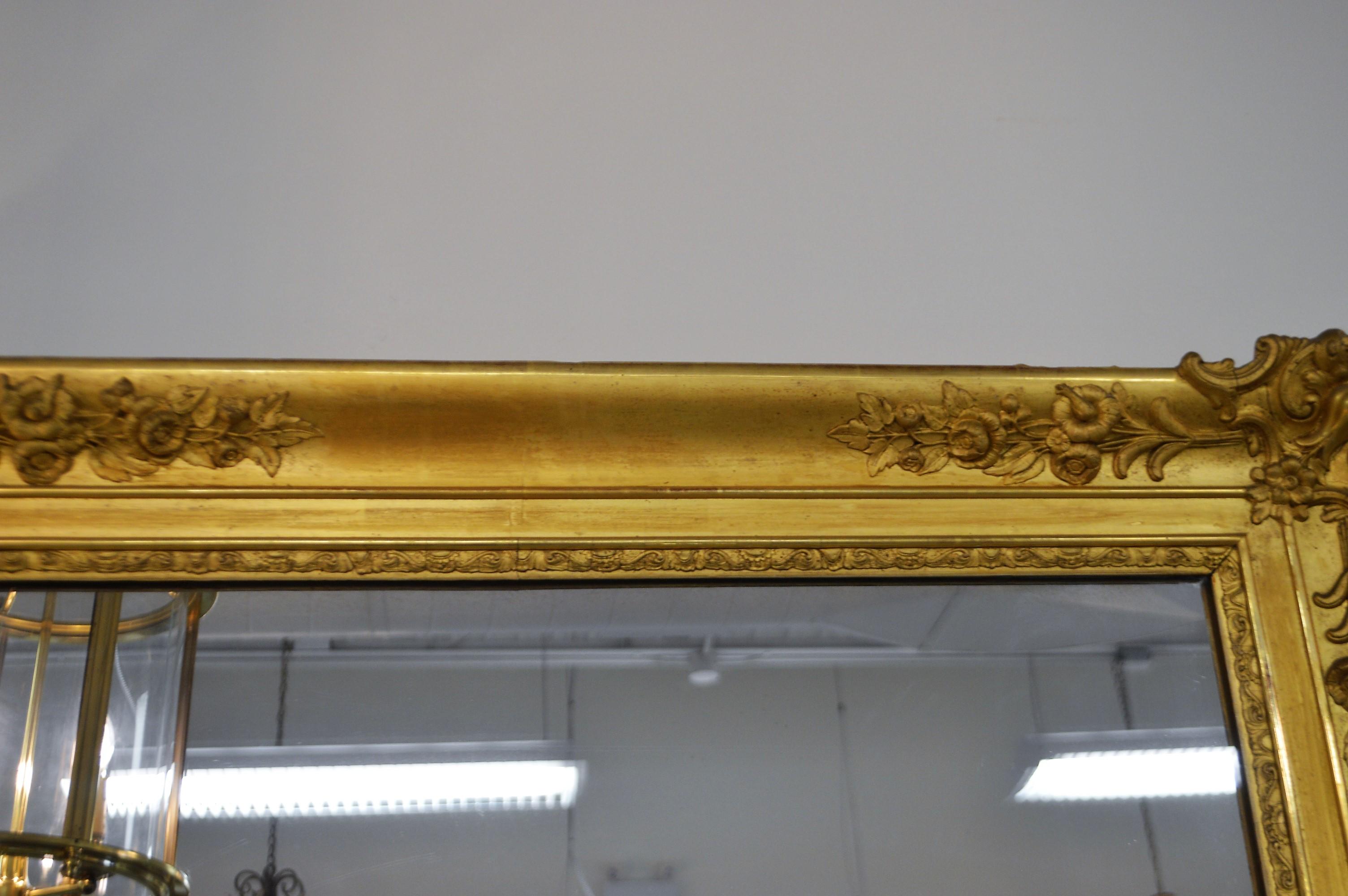 Louis XV 19th Century French Gilded Mirror with Hand Carved Details in All Four Corners For Sale