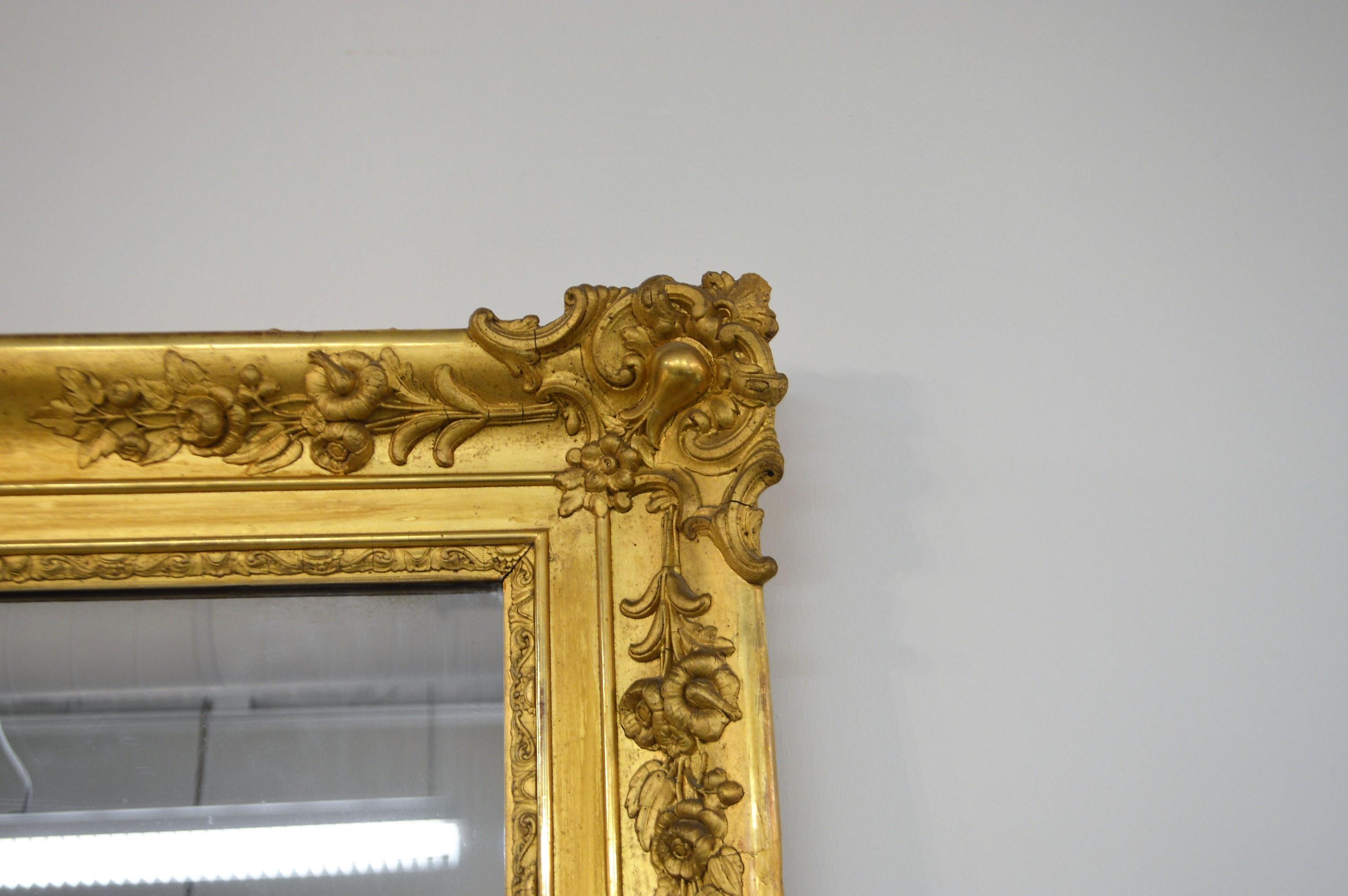 Gilt 19th Century French Gilded Mirror with Hand Carved Details in All Four Corners For Sale
