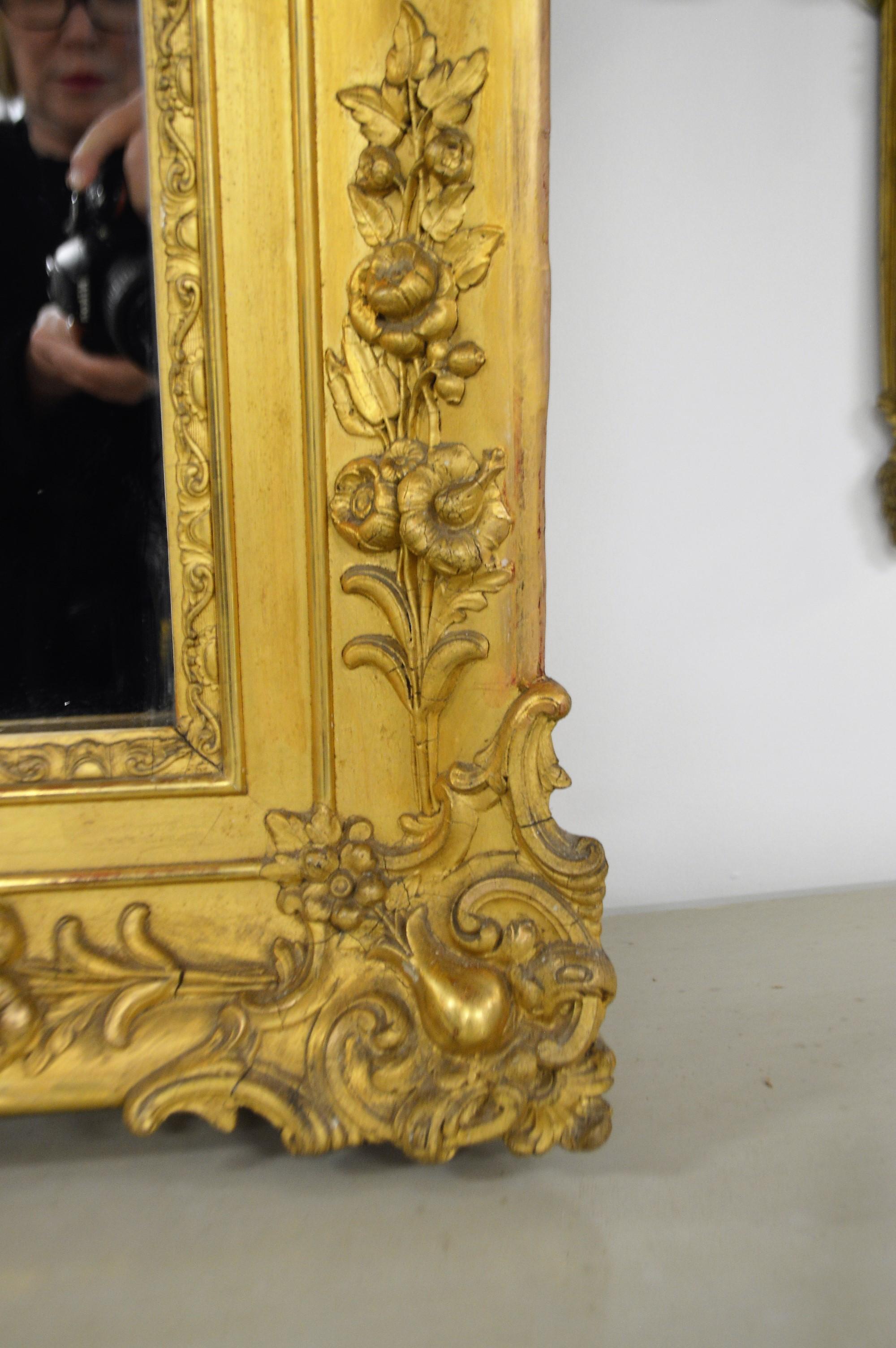 Wood 19th Century French Gilded Mirror with Hand Carved Details in All Four Corners For Sale