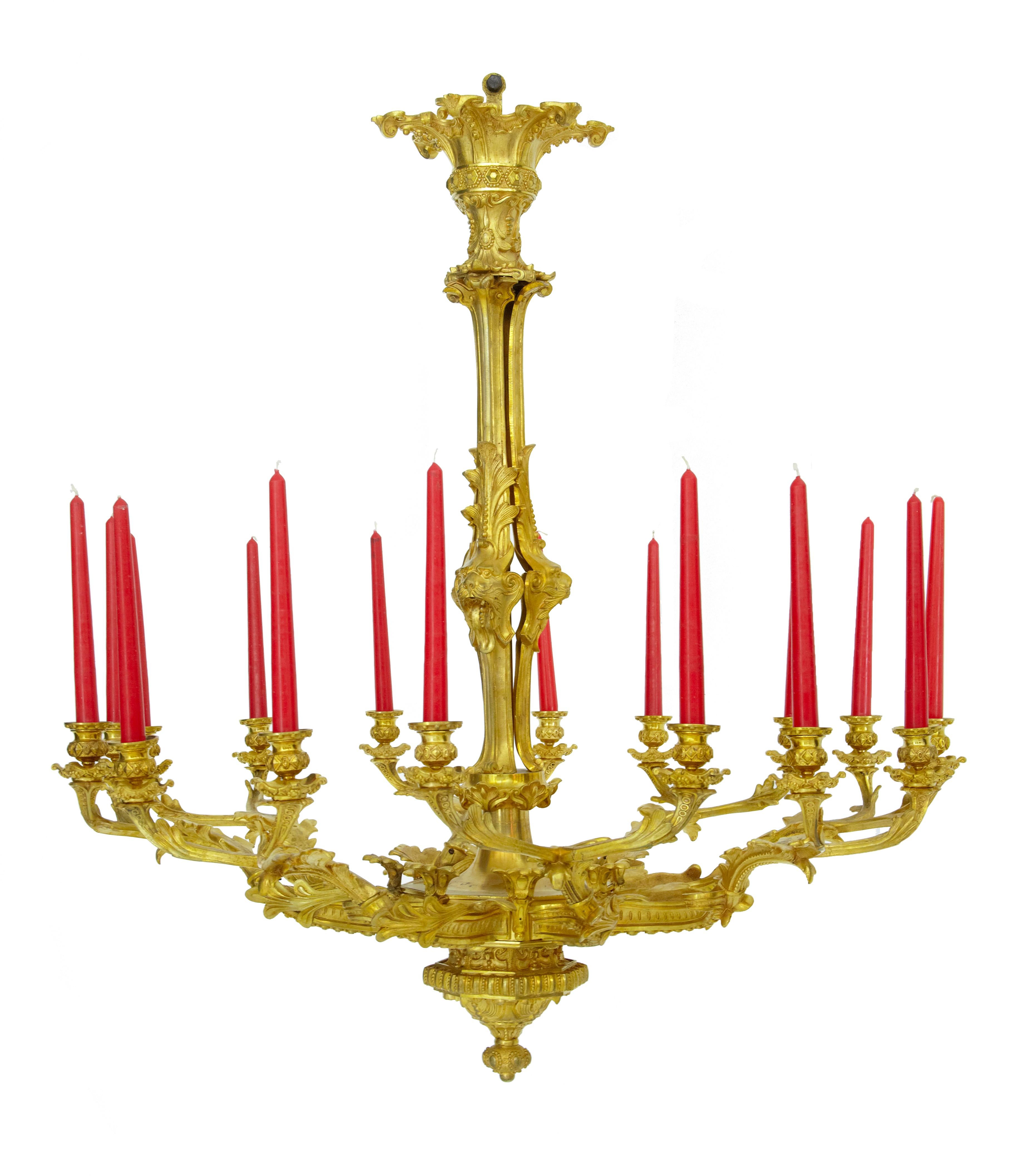 19th century French gilded ormolu 8-arm chandelier circa 1880.

Made in France using a technique called mercury gilding. 8 arms which hold 2 candles on each. Decorated with acanthus leaves and lions heads. We have to stress this is of the finest