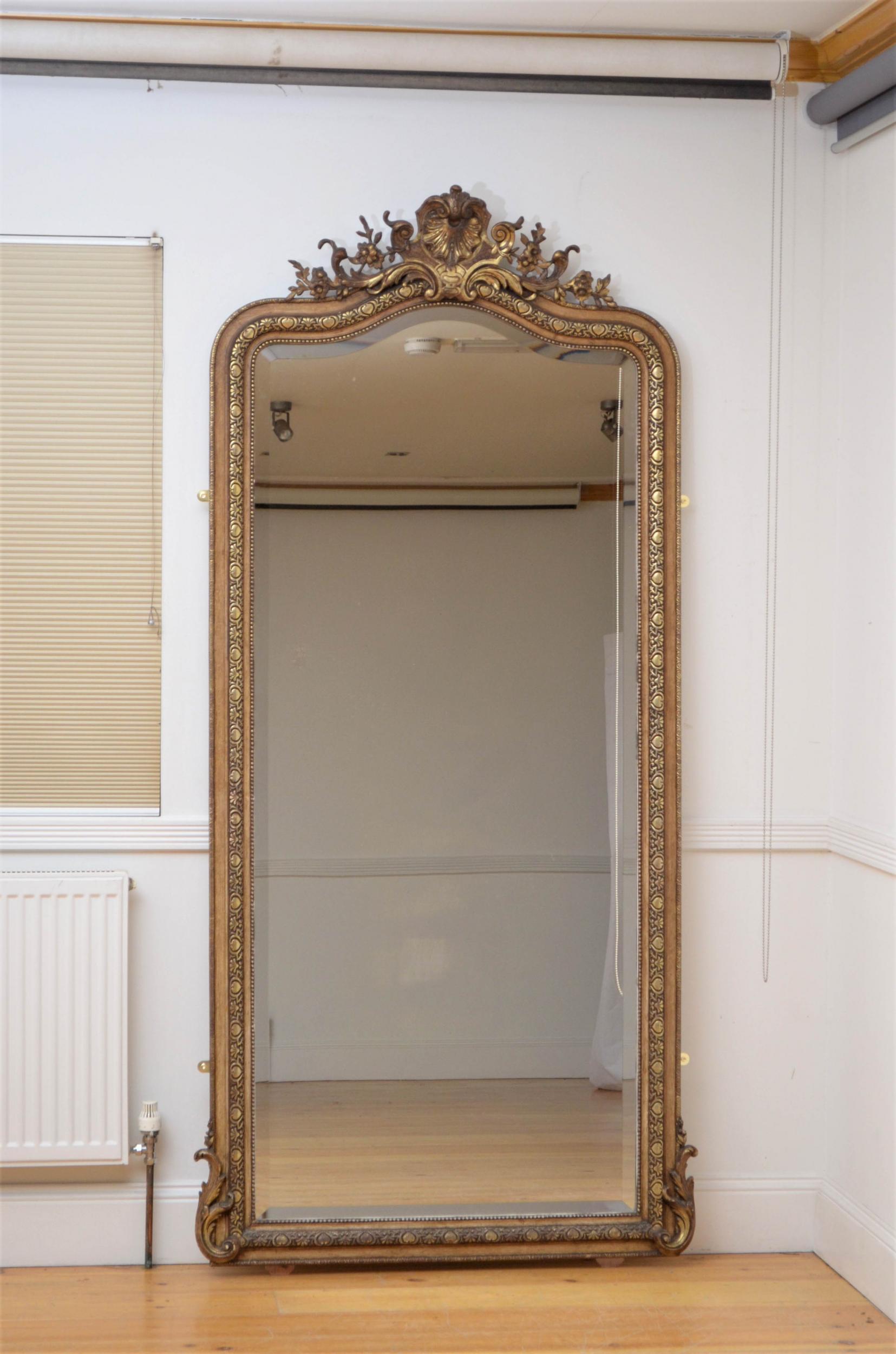 Sn5021 exceptional 19th century French simulated walnut and gilt mirror, having original bevelled edge glass with some imperfections in beaded and finely carved frame with leafy scrolls to the base and shell centre crest decorated with foliage