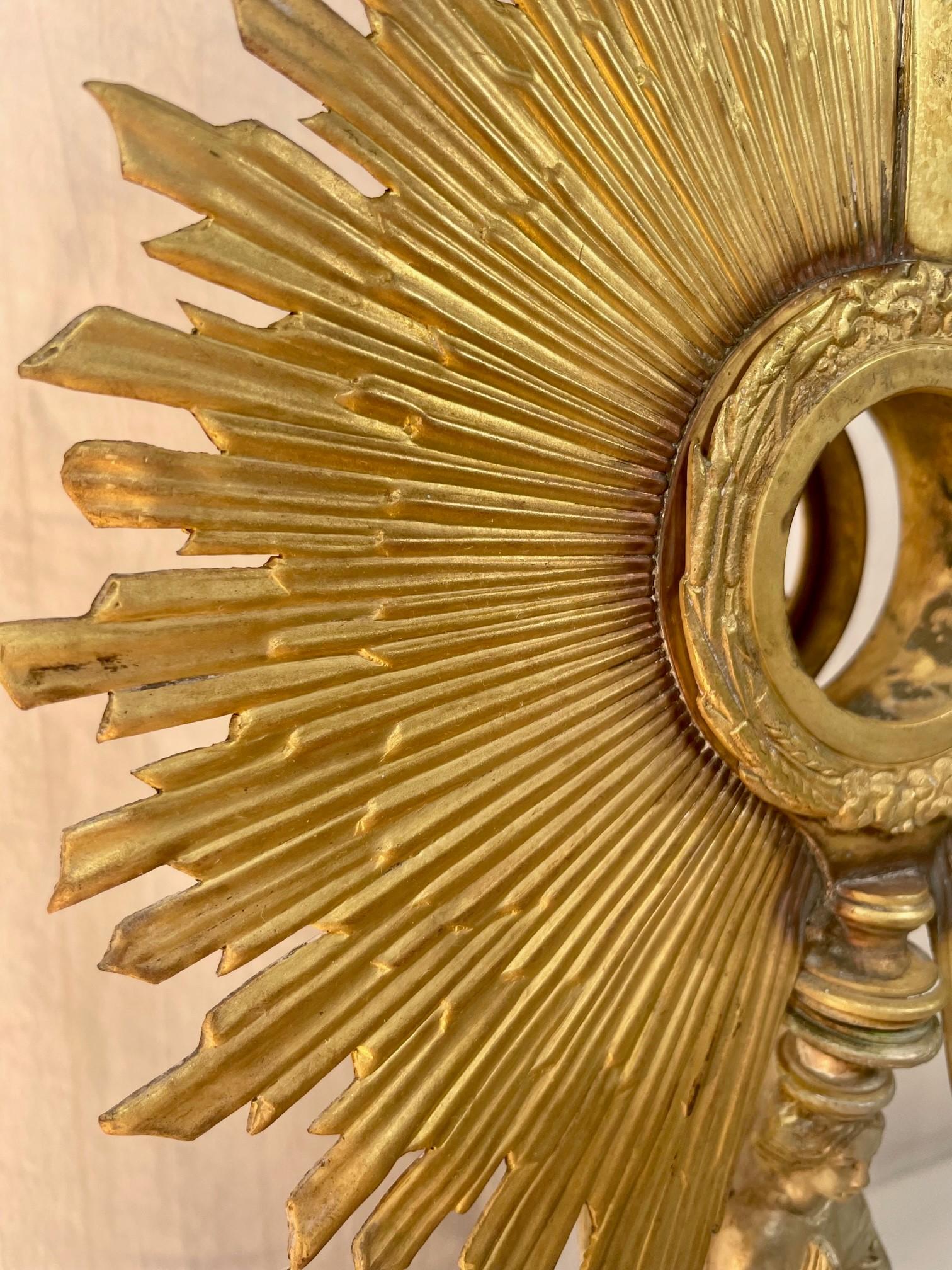 19th century French gilt brass Eucharistic Monstrance with cross and
Wheat Design.

Impressive 19th century gilt brass church reliquary monstrance. Crafted in France, circa 1850, this beautiful golden reliquary is adorned with a glowing sunburst.