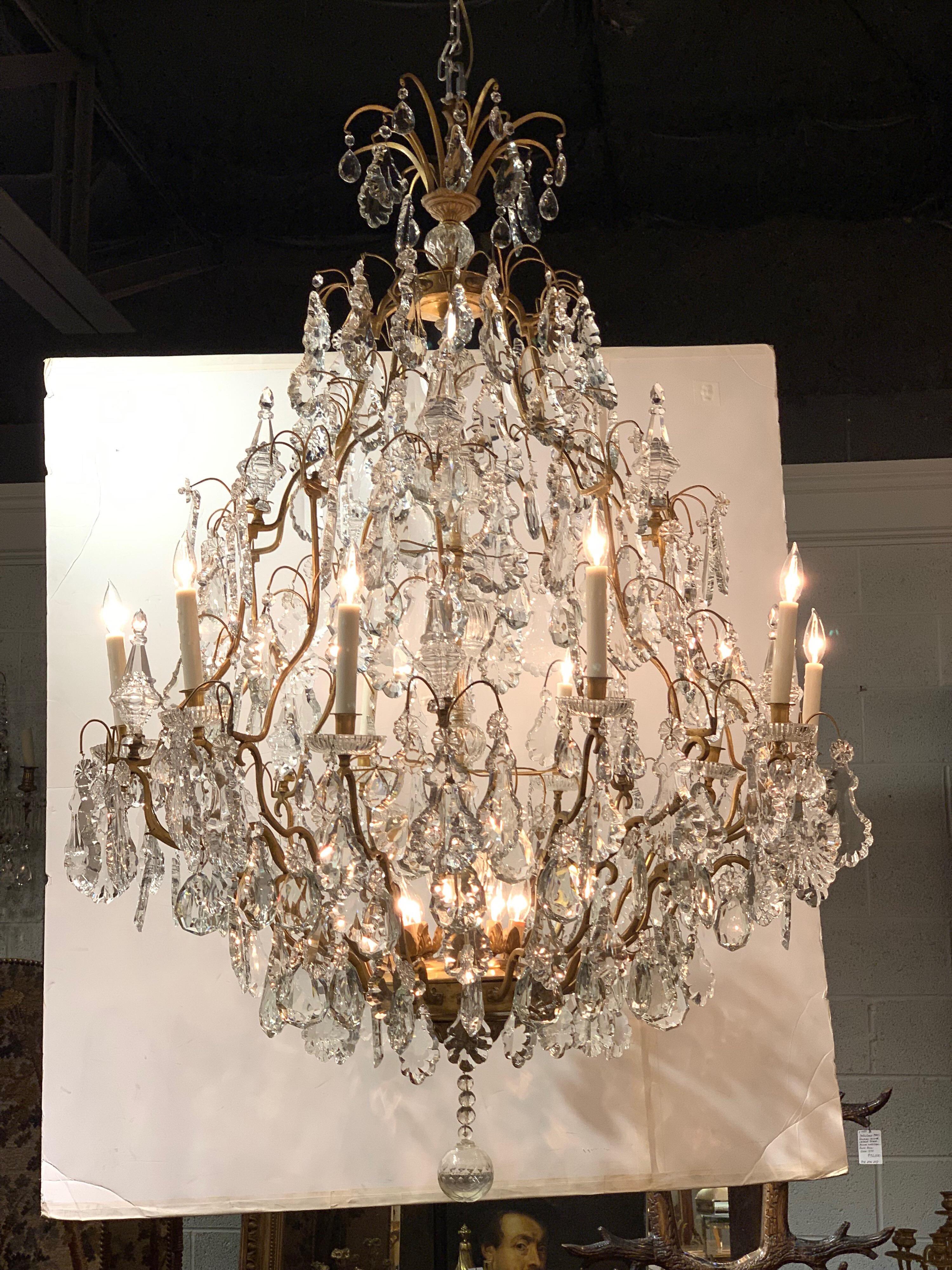 Impressive large bronze and crystal 15 light chandelier from France. Very nice scrolled stem base holds a multitude of handcut crystals. True elegance for a large space!