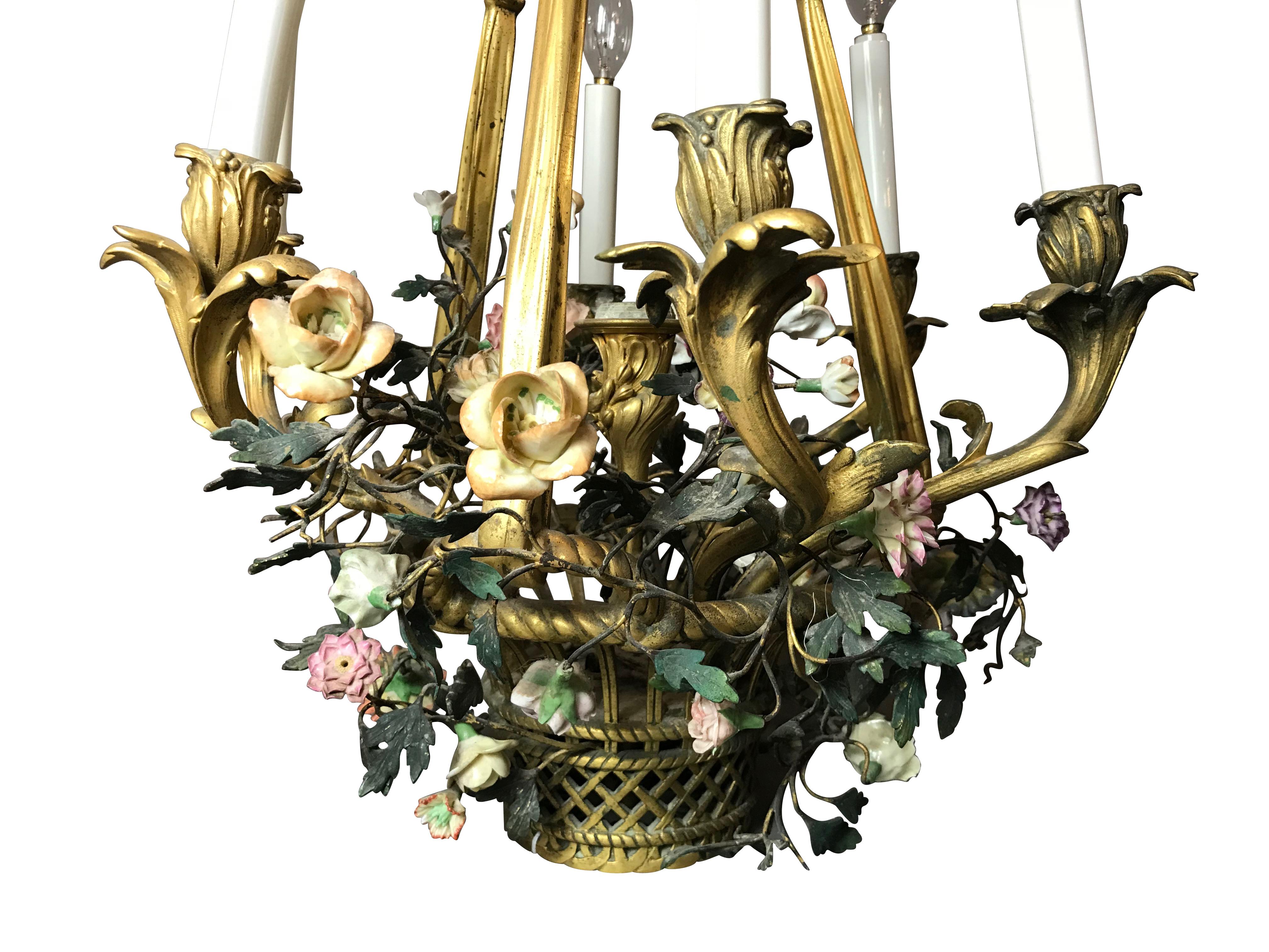 19th century French gilt bronze and enamel flower basket six-light chandelier

Beautifully made woven bronze basket with several enameled bronze flowers sticking out of the basket as if it were a flower pot. The gilt in very good condition and