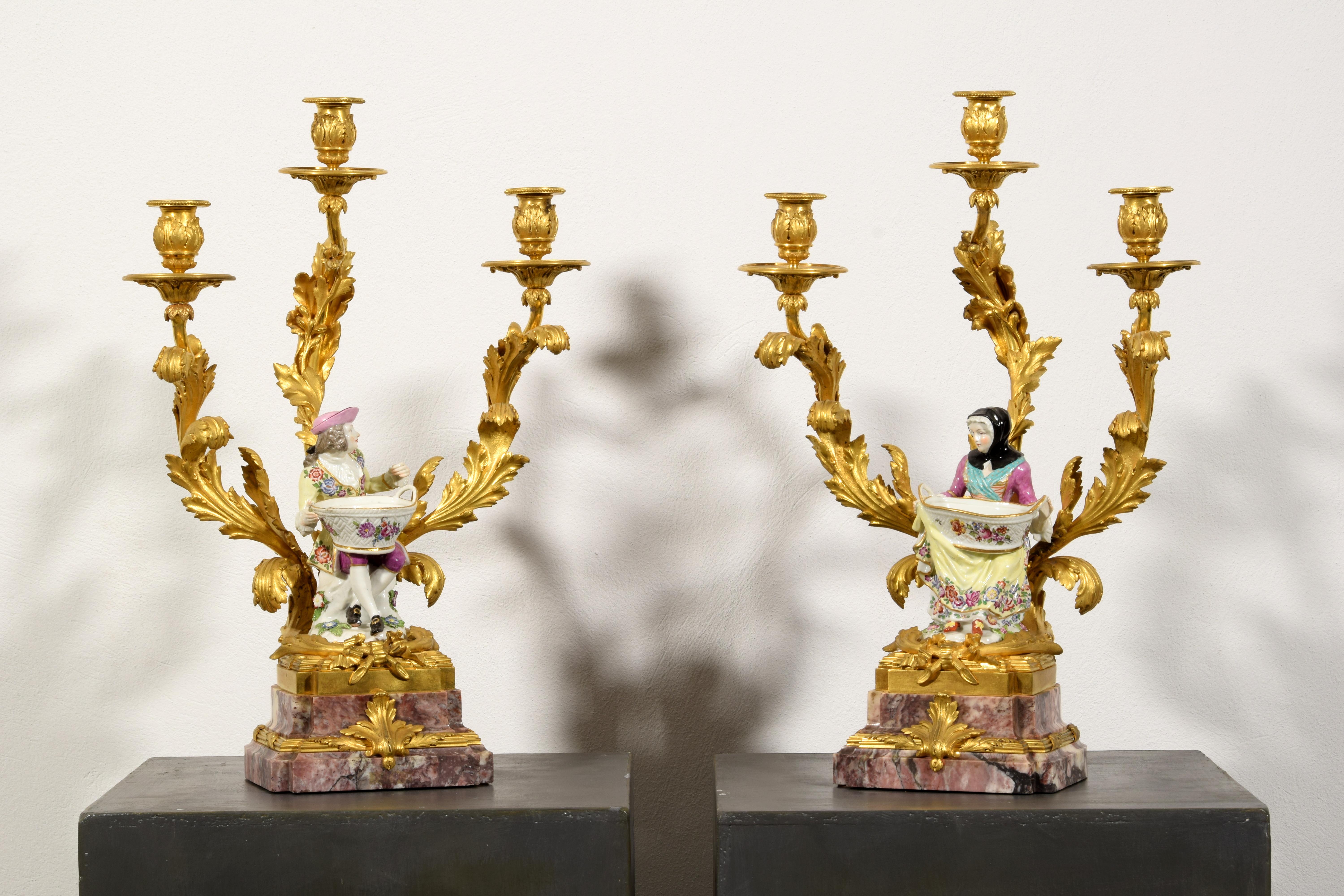 19th Century, Pair of French Gilt Bronze Candlesticks with Polychrome Porcelain, marble base 

The pair of elegant candlesticks with three lights was made in France, in the nineteenth century, in finely chiselled and gilded bronze. Stylistically