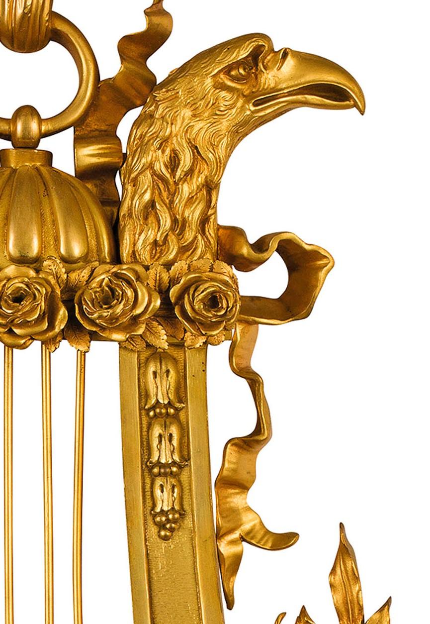 19th century, French gilt bronze Cartel clock

The finely chiseled and gilt bronze Cartel clock was made in France at the end of the 19th century.
With the name Cartel are defined those clocks, originally typically French, intended to be hung on