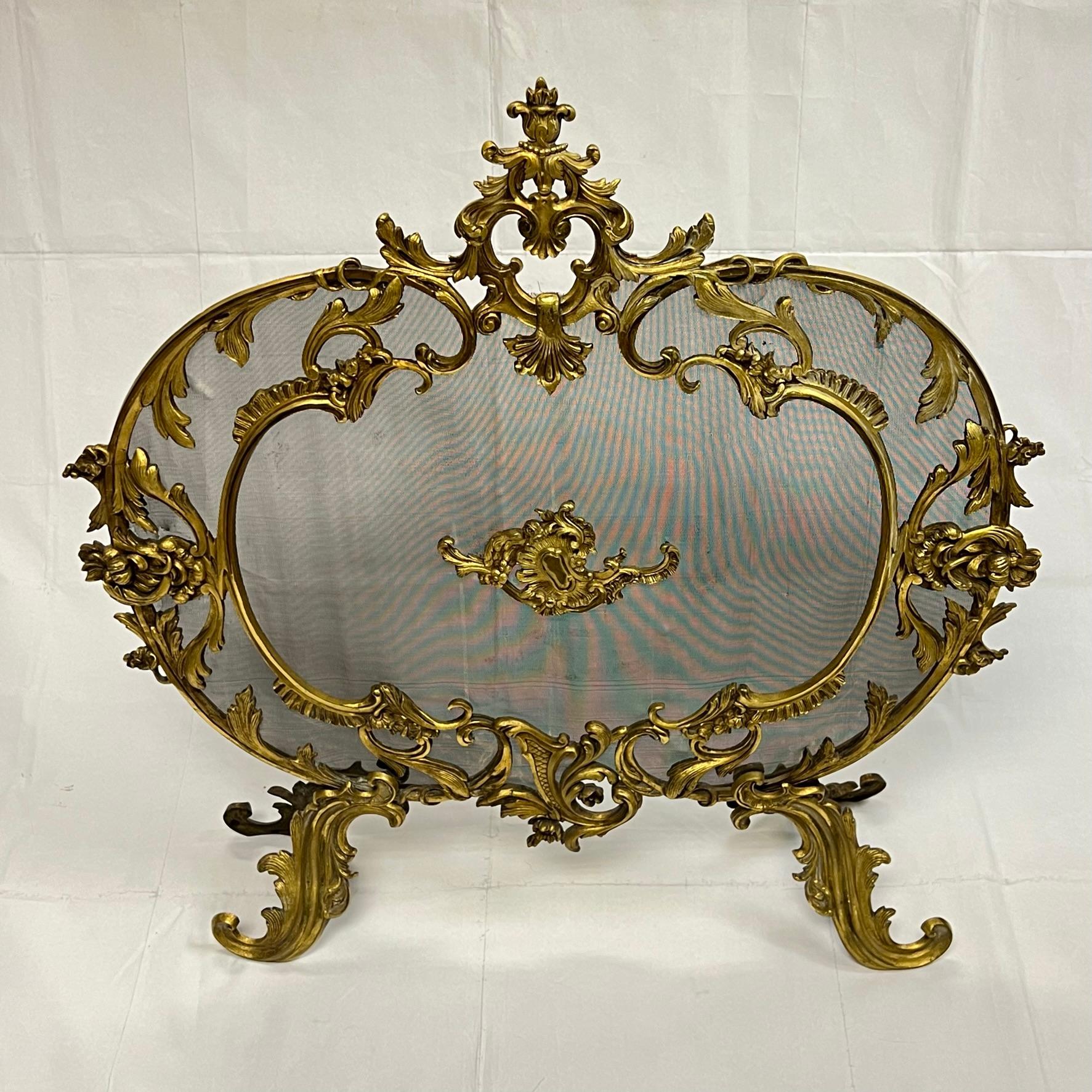 Antique French 19th century gilt bronze fireplace screen in Louis XV / XVI style.