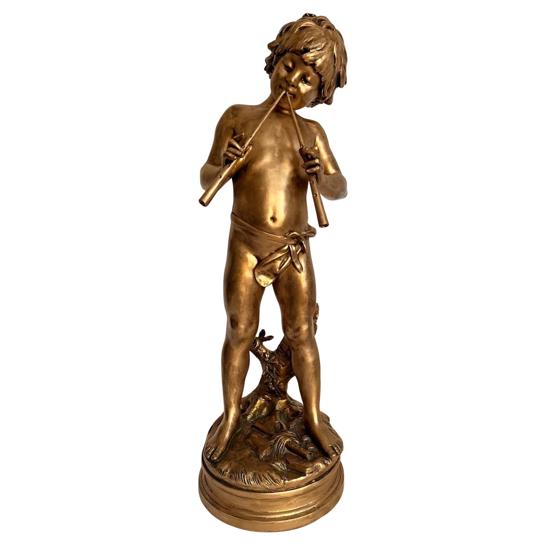 19th Century French Gilt Bronzed Sculpture “Boy with Flute”, Signed Aug. Moreau.

Large sculpture of a young boy with an aulos (double flute), created by French artist Auguste Moreau (1834-1917). It features an adorable, mythical pan of ancient