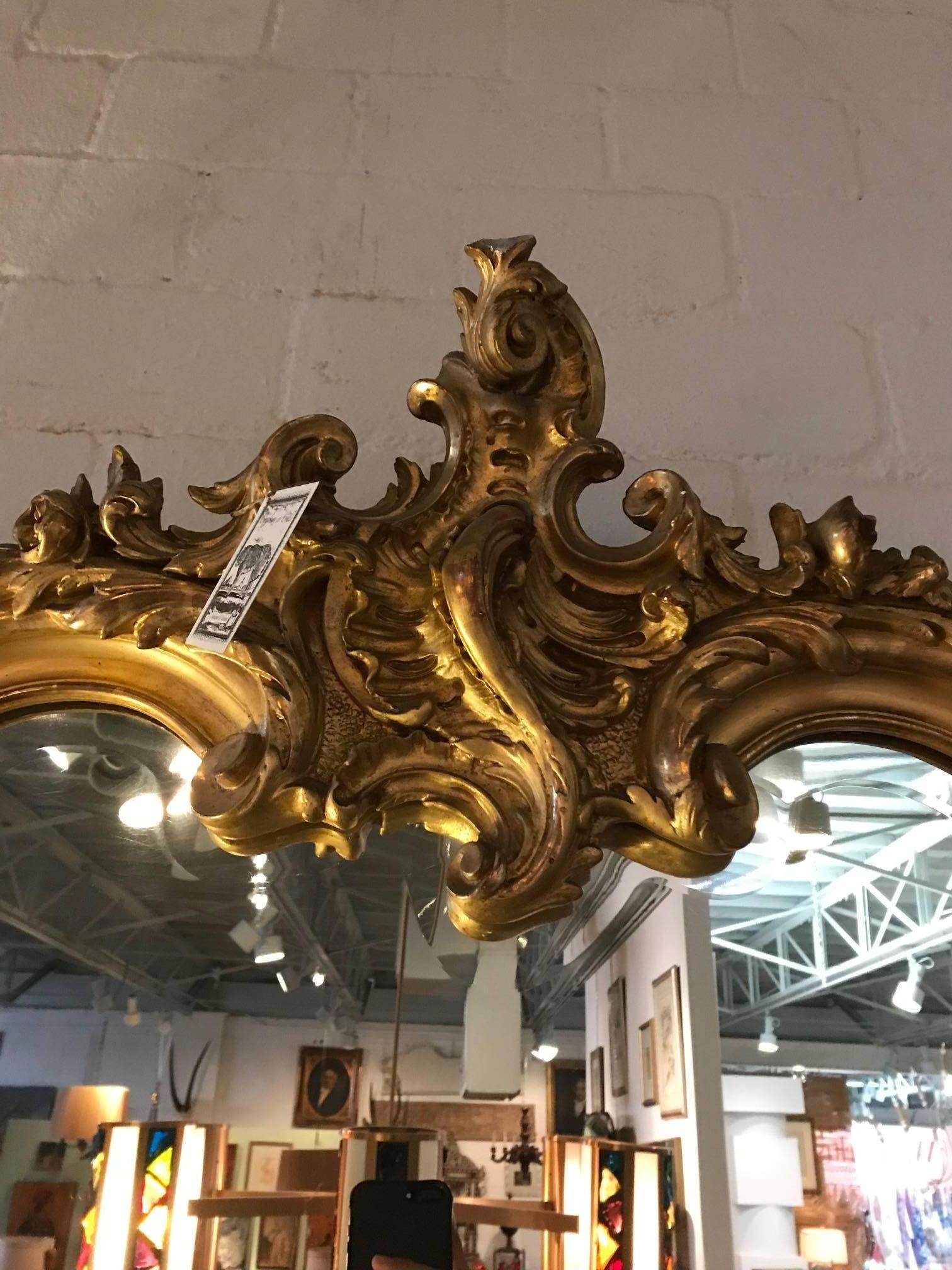 Large golden mirror with beautiful French details.