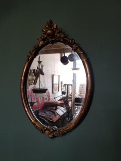 19th Century French Gilt Oval Shaped Mirror with Fruit Ornaments