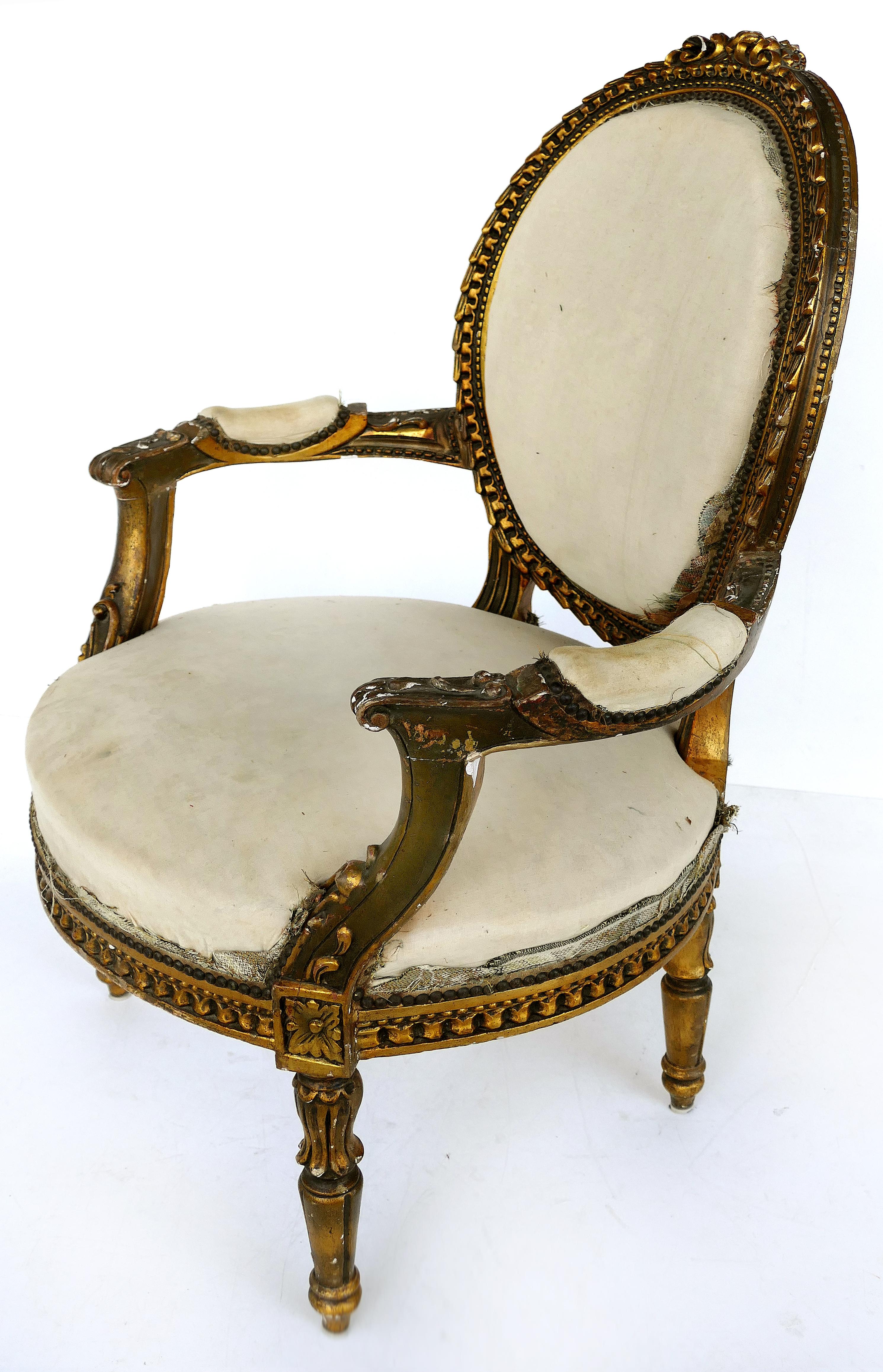 19th century French giltwood fauteuil armchairs, pair

Offered for sale is a pair of late 19th century Louis XVI French giltwood fauteuil armchairs shown in muslin and in need of upholstery. The chairs show an aged patina.

Measures: Arm, 24.5