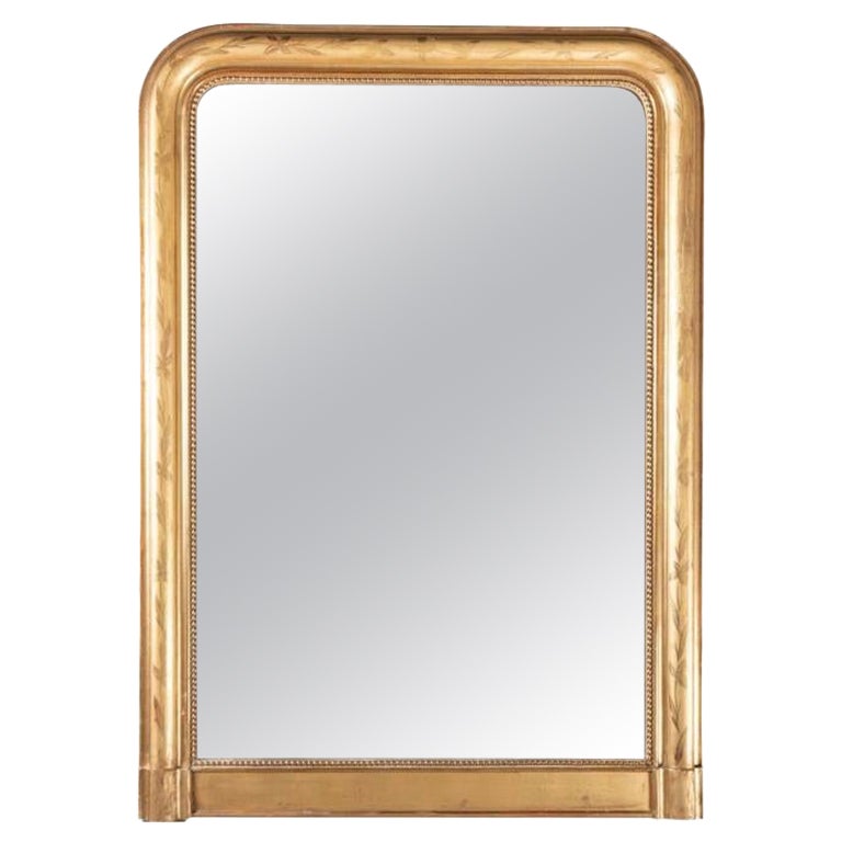 19th century French giltwood and engraved mantel mirror
