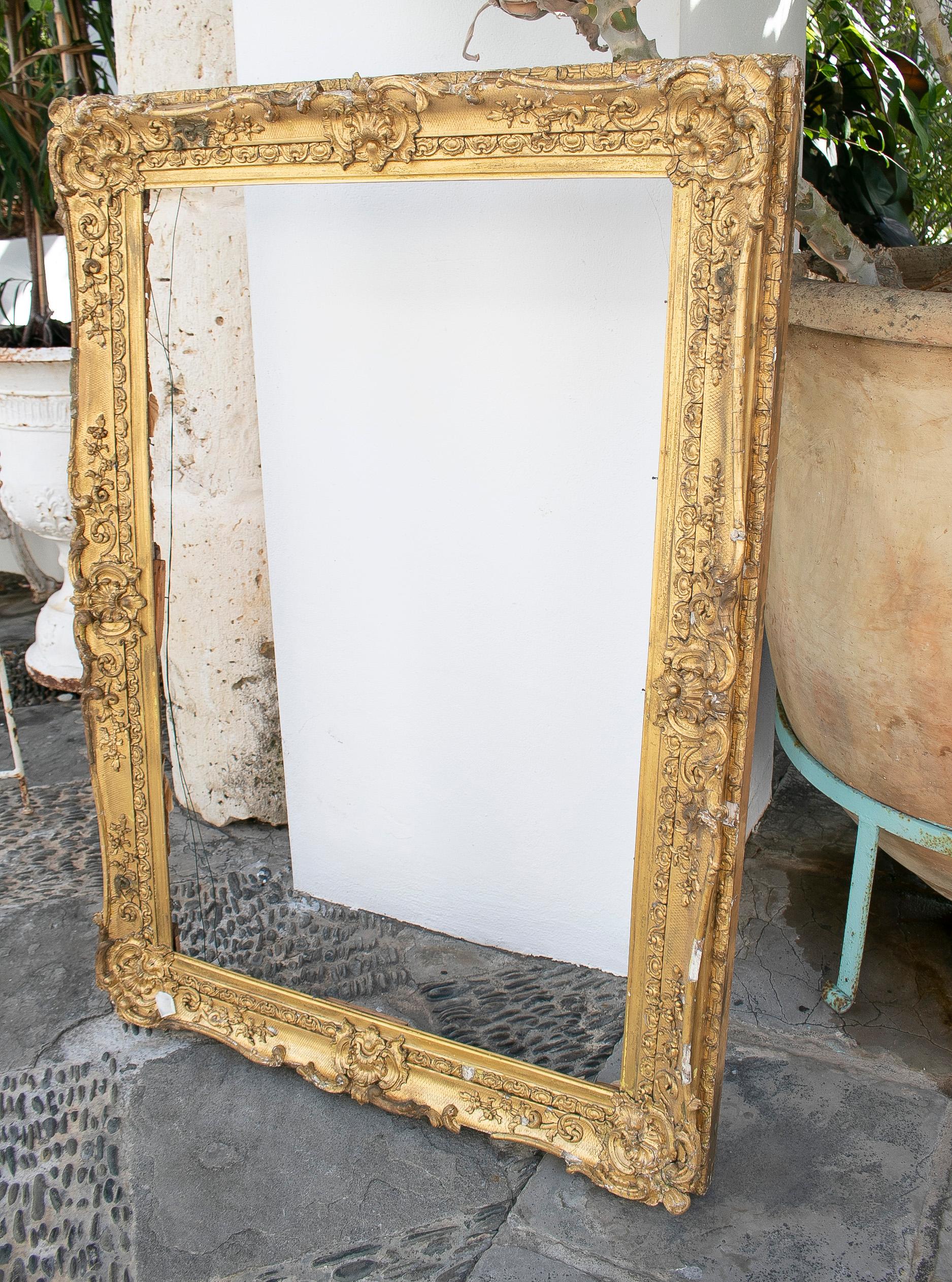 Antique 19th century French giltwood and stucco baroque frame