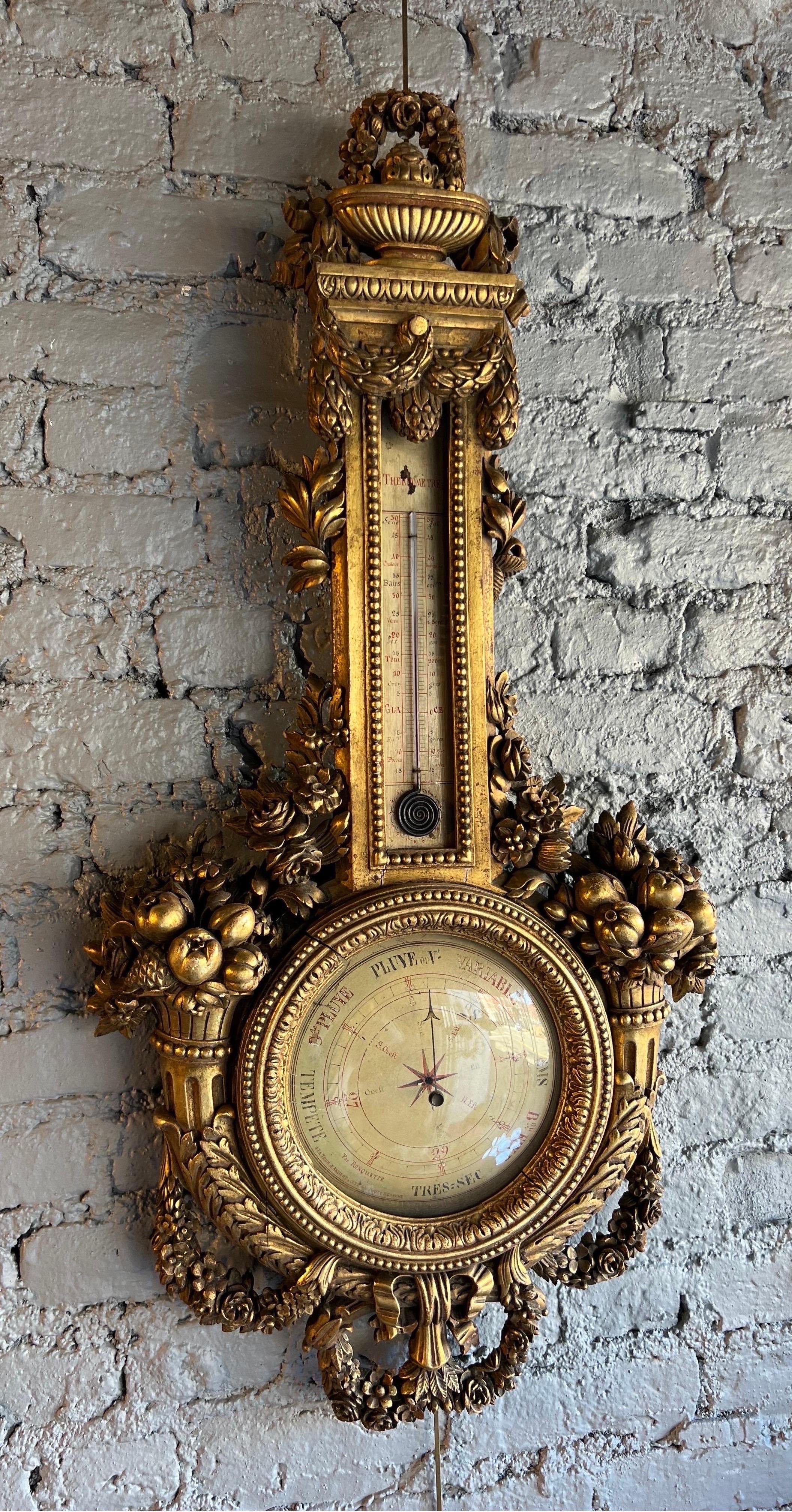 19th Century French giltwood barometer with working thermometer. Well executed carvings of scrolls, swags and bounty all finished in gold gilding. Great example of a classic French barometer.