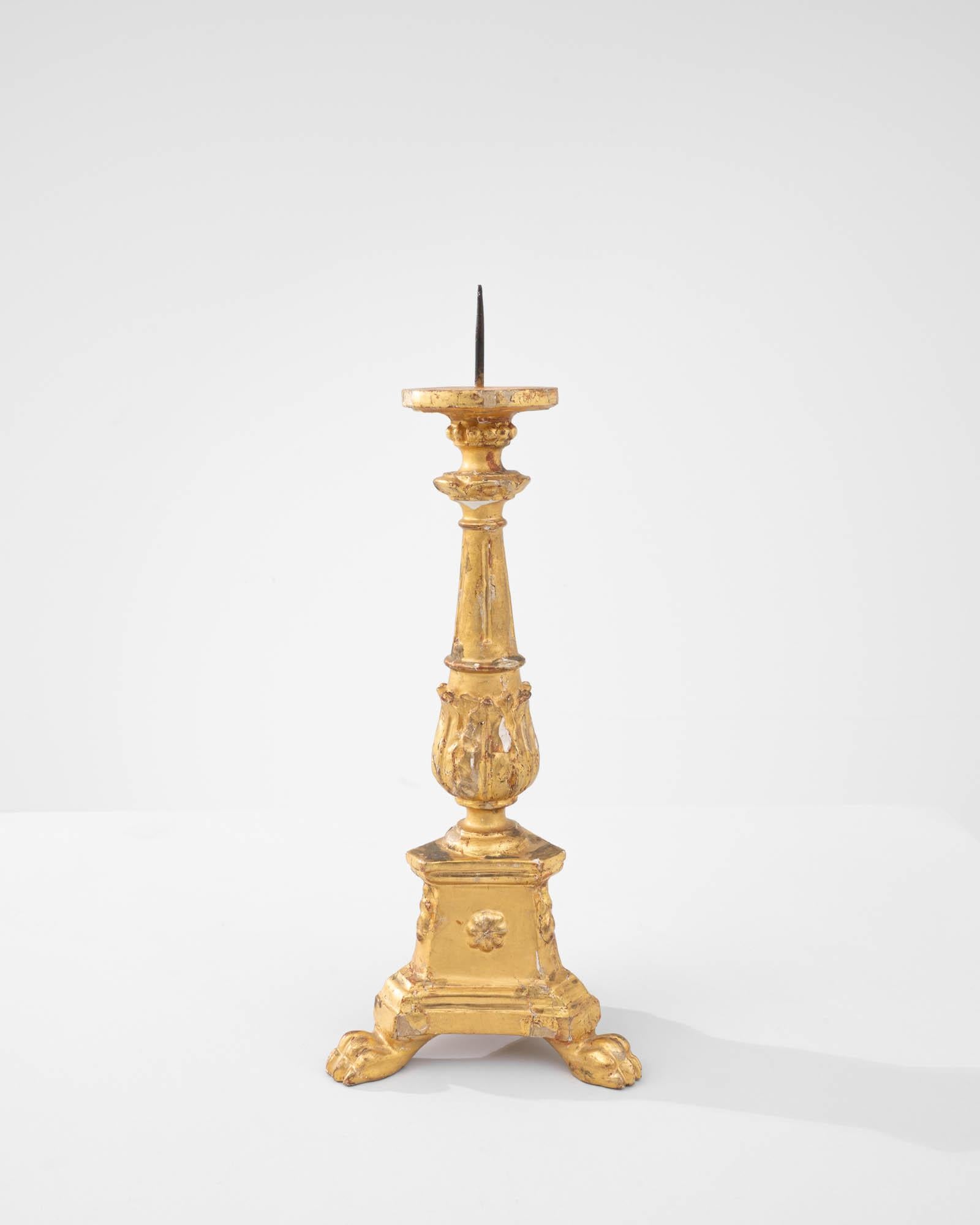 This wooden candle holder was made in France. An ancient tradition of necessity and pleasure: providing light, emitting heat, pleasant fragrances, and keeping time– the little flame of the candle captures it all. This elegant giltwood candlestick