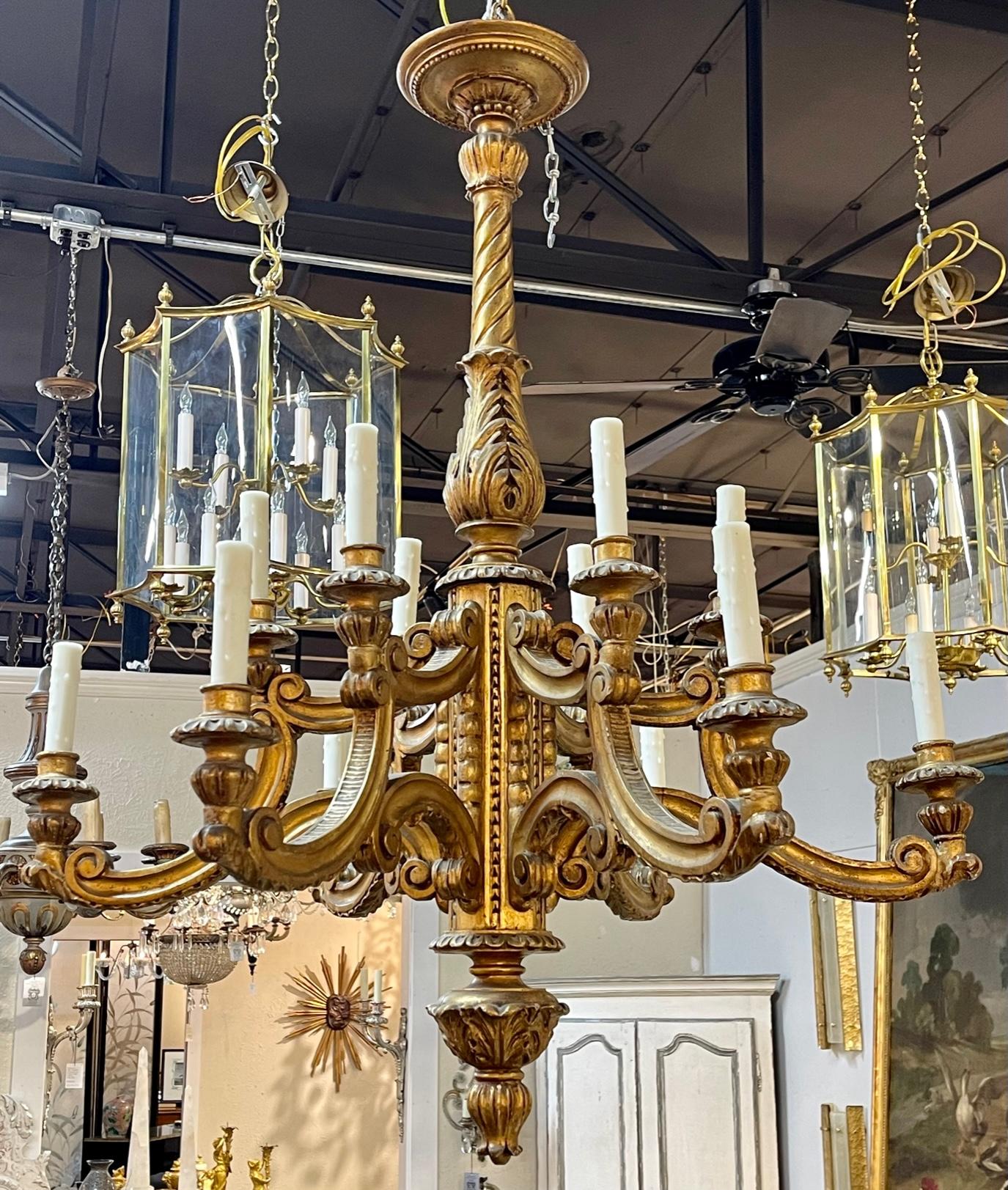 19th Century French carved and gilt wood 12-light chandelier. The chandelier has been professionally re-wired, cleaned and is ready to hang. Includes matching chain and canopy. A fine addition to any home!