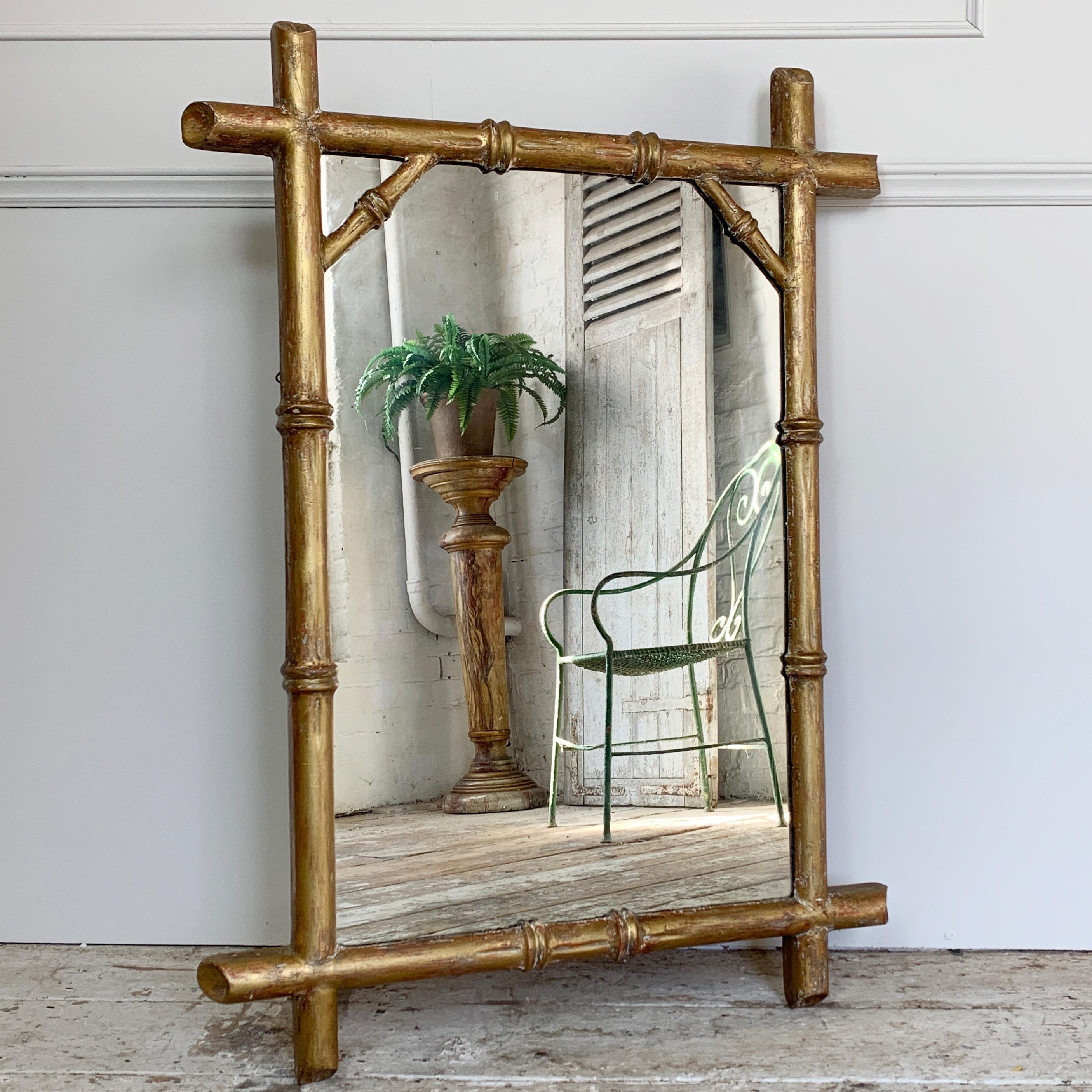Gilt wood faux bamboo mirror, French, 19th century

The mirror has beautiful wide faux bamboo frame with diagonal corner details. 
Original gilt/gesso finish
Some very light foxing to the mirror plate in areas
Original wooden backboards

99cm