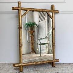 Miroir français du 19ème siècle en bois doré et faux bambou