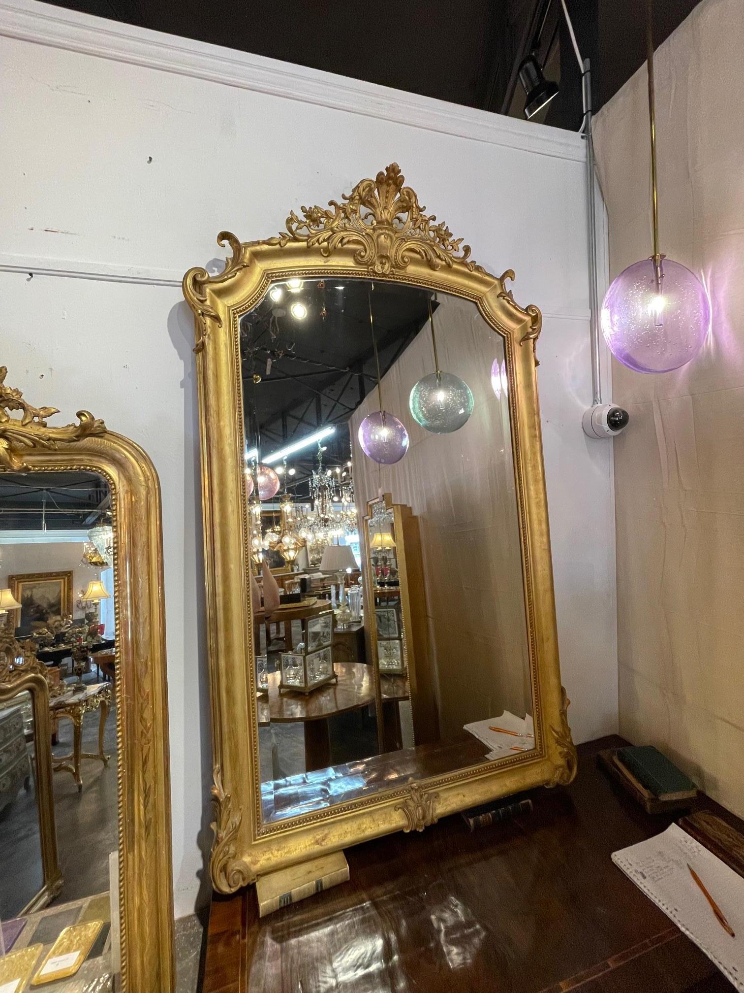 19th century French transitional giltwood mirror. Circa 1870. This is a fine quality mirror that is sure to make a statement.