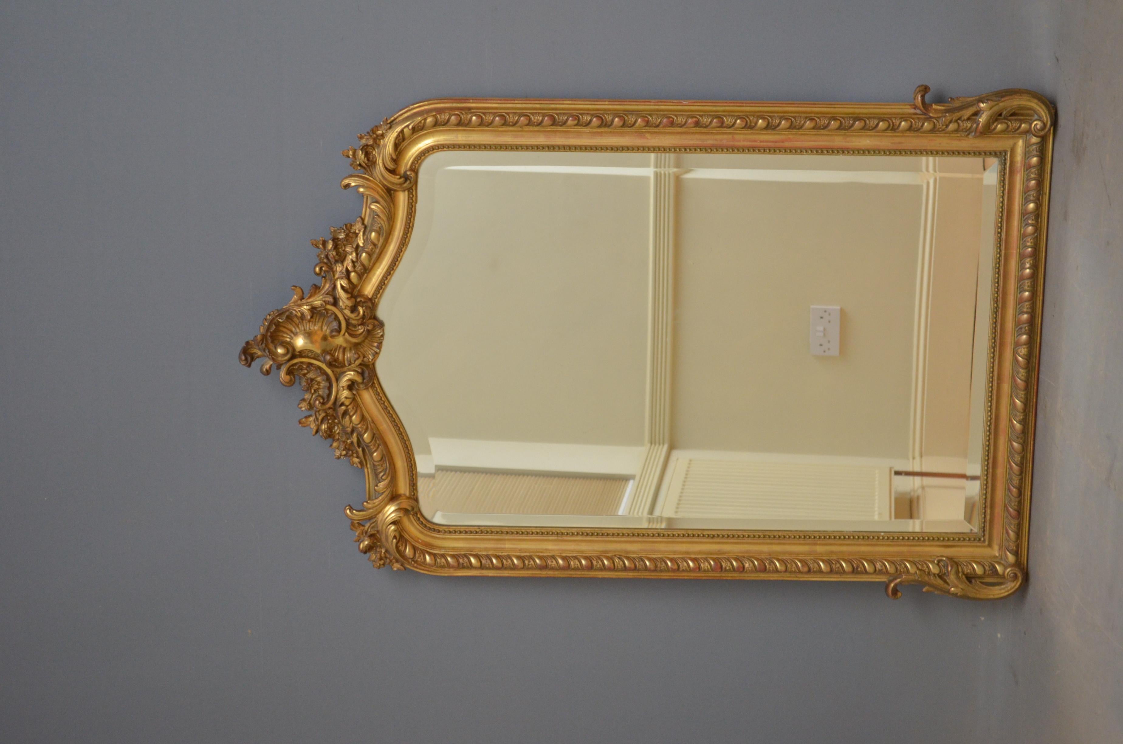 Sn4599 19th century French gilded mirror, having bevelled edge glass in finely decorated giltwood frame. This antique mirror retains its original glass with some foxing, original gilt and original backboards, all in home ready condition, circa