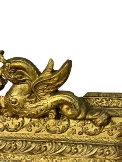 19th Century French Giltwood Mirror with Hand-Carved Dolphin Crest