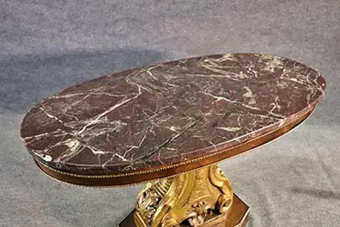 The 19th Century French Giltwood Occasional Table with a Rouge Marble Top is a luxurious and elegant piece of furniture. The table features a heavily carved base and beautiful marble top. a wonderful addition to any home. Circa 1870
55w x 28d x 33h