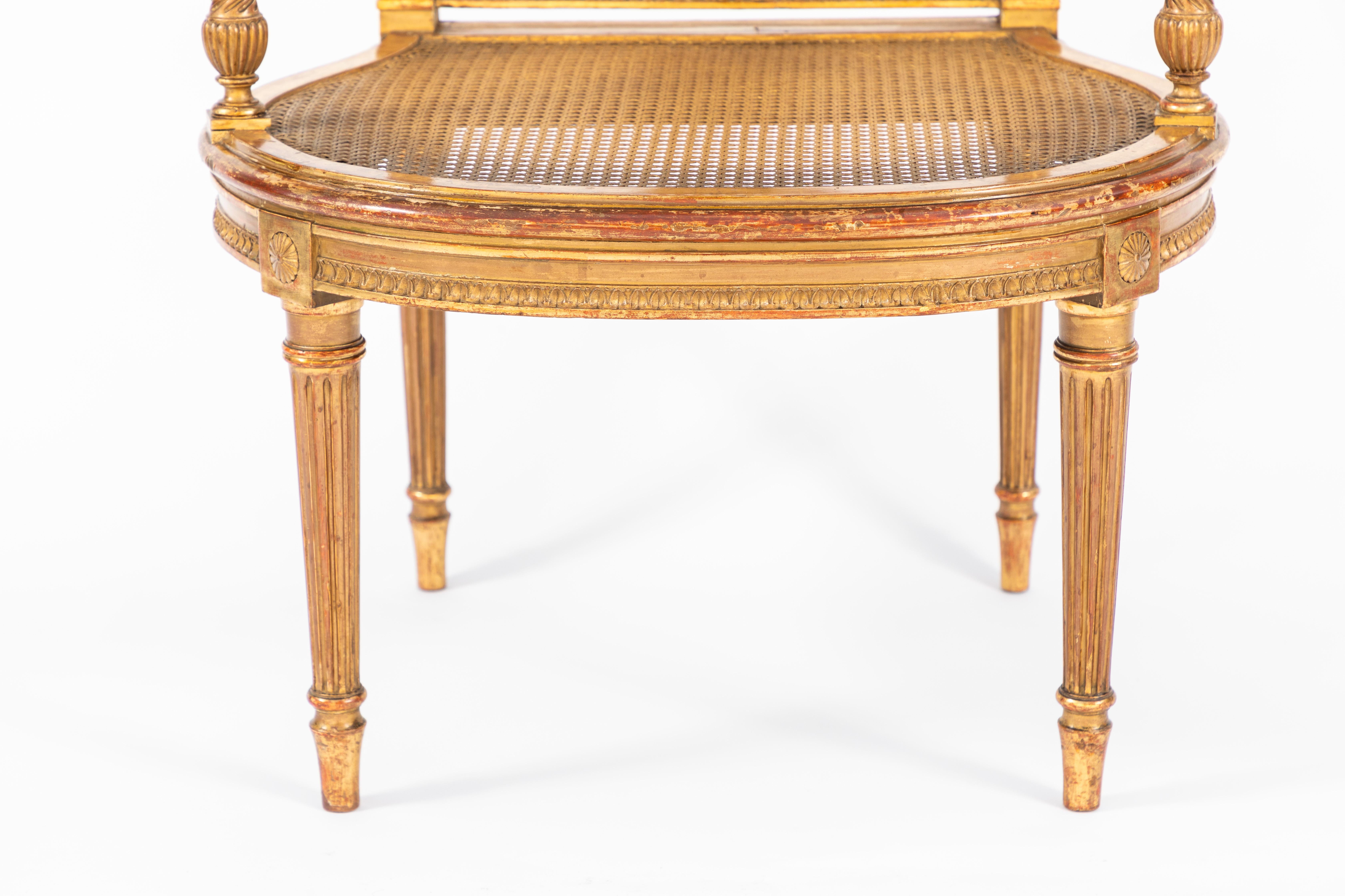19th Century French giltwood single open arm chair with finely carved lyre motif. This chair is comfortable, strong and sturdy.