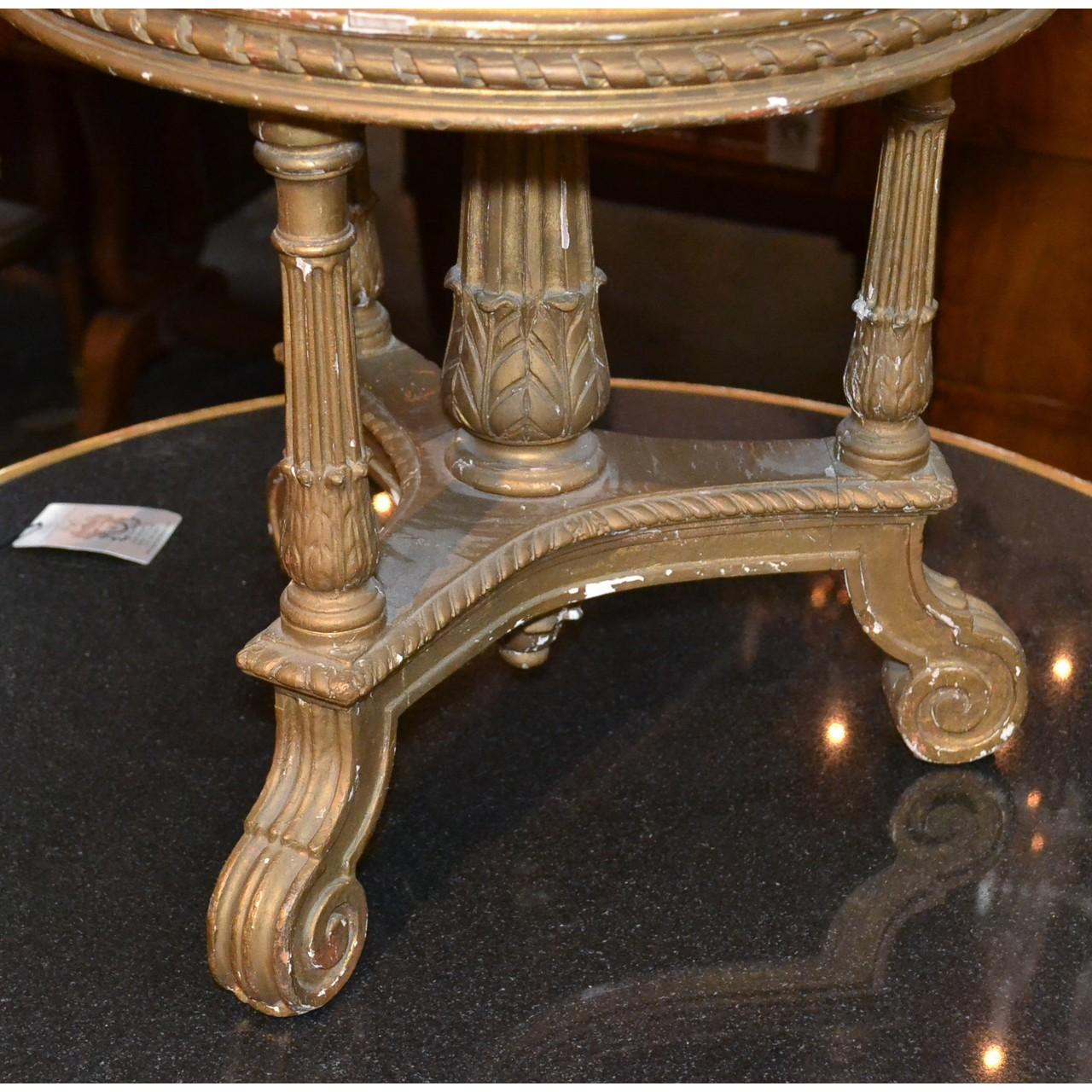 19th century French giltwood circular stool with an Asian motif upholstered top. The apron with carved rope trim above fluted columns with acanthus leaf accents. The entire on a tripod base with reverse scrolled feet,

circa 1890.

Would make a