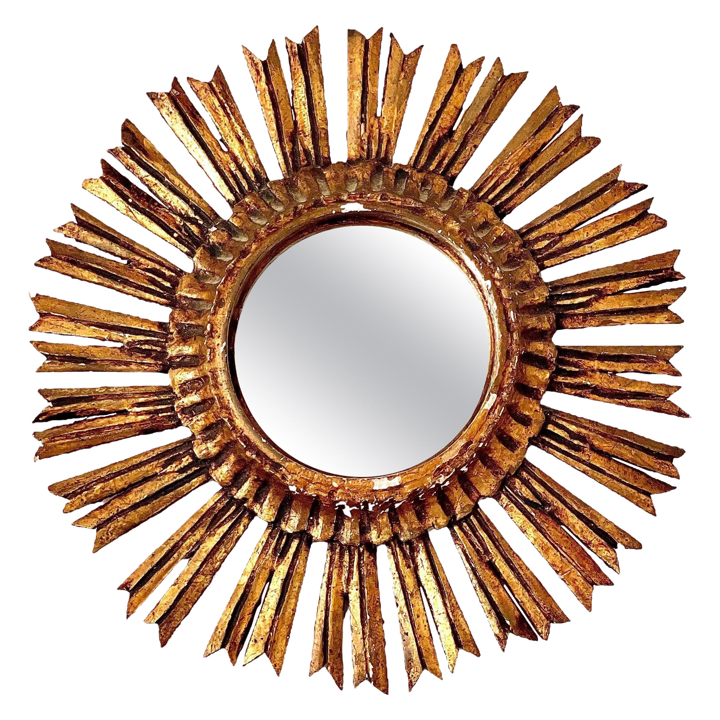 Espejo francés del siglo XIX de madera dorada con reflejo de sol