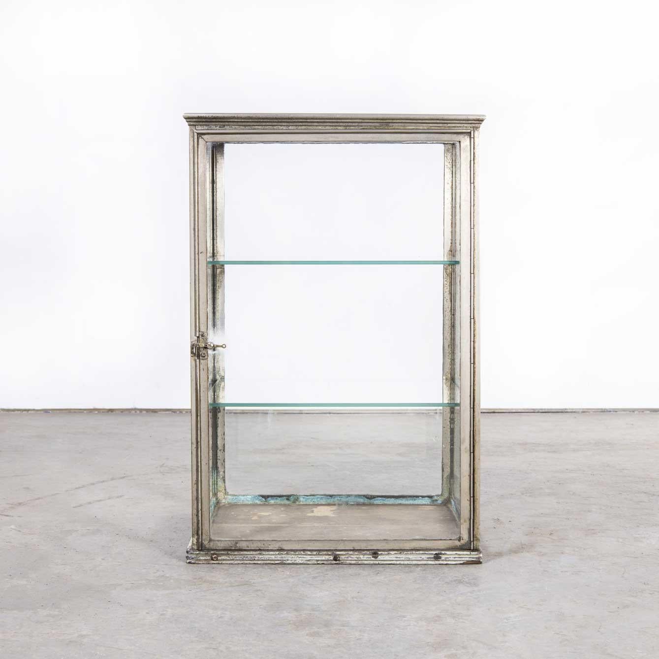 19th century French glass and chrome shelved shop display cabinet
19th century glass and chrome shelved shop display cabinet. Display cabinets of this size and originality with a dull chrome frame and original wood base are very hard to find.