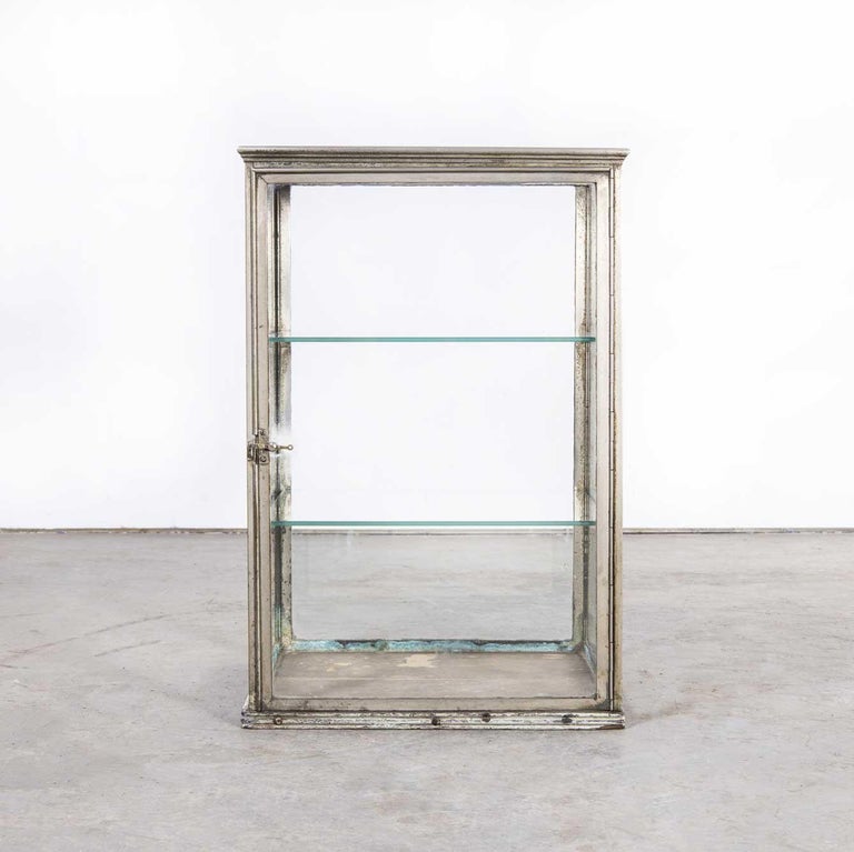 19th century French glass and chrome shelved shop display cabinet
19th century glass and chrome shelved shop display cabinet. Display cabinets of this size and originality with a dull chrome frame and original wood base are very hard to find.