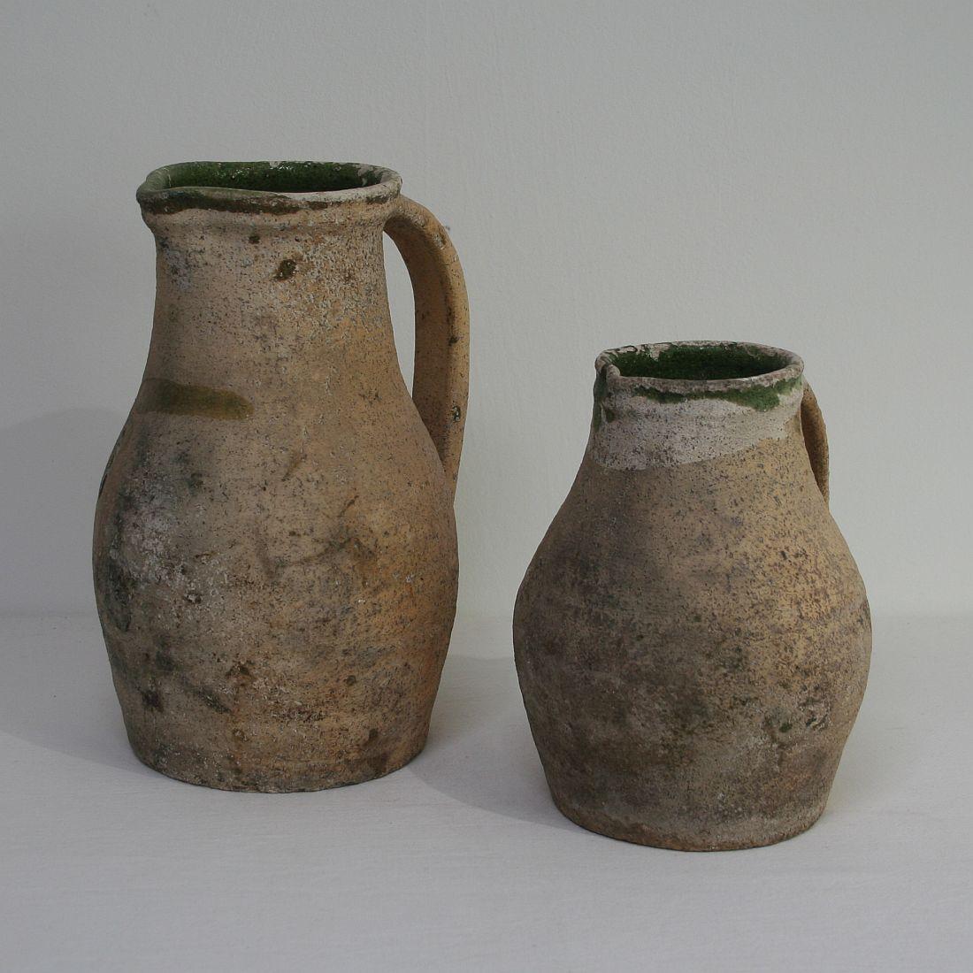 Pair of beautiful earthenware pitchers, France, circa 1800-1850.
Weathered.