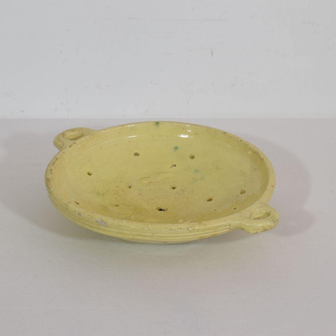 Wonderful earthenware strainer with a stunning glaze. France circa 1880-1900. Good condition.