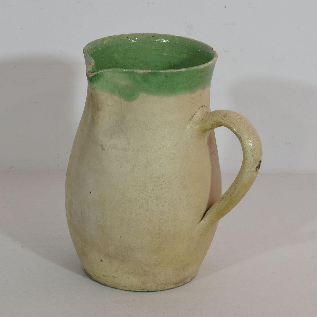 Great authentic and rare piece of pottery from the Provence. Beautiful weathered and an amazing color. Imperfections help authenticate this water cruche as it was an utilitarian type piece. France, circa 1850-1900.