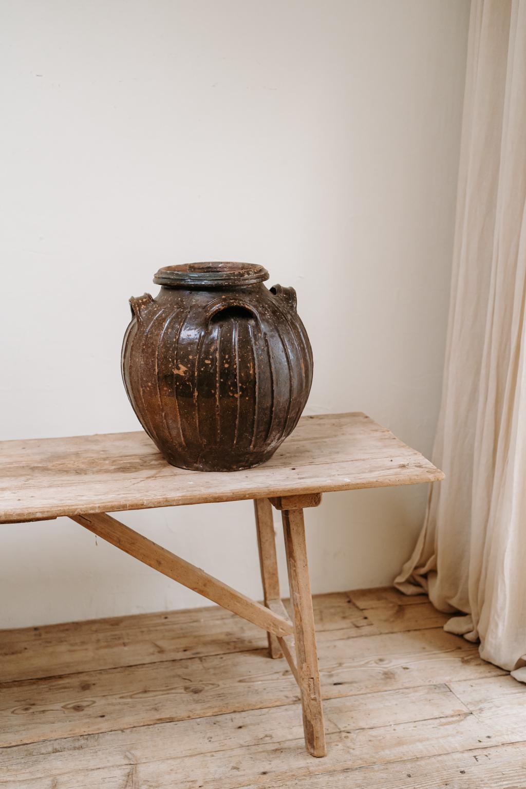 Very decorative item this darkgreen glazed terracotta urn.