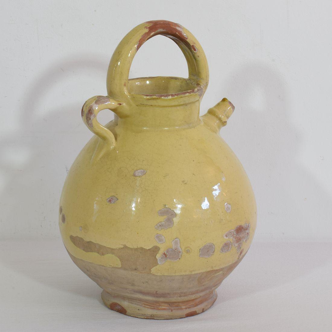 Great authentic and rare piece of pottery from the Provence. Beautiful weathered and an amazing color. Imperfections help authenticate this water cruche as it was an utilitarian type piece, France, circa 1850.