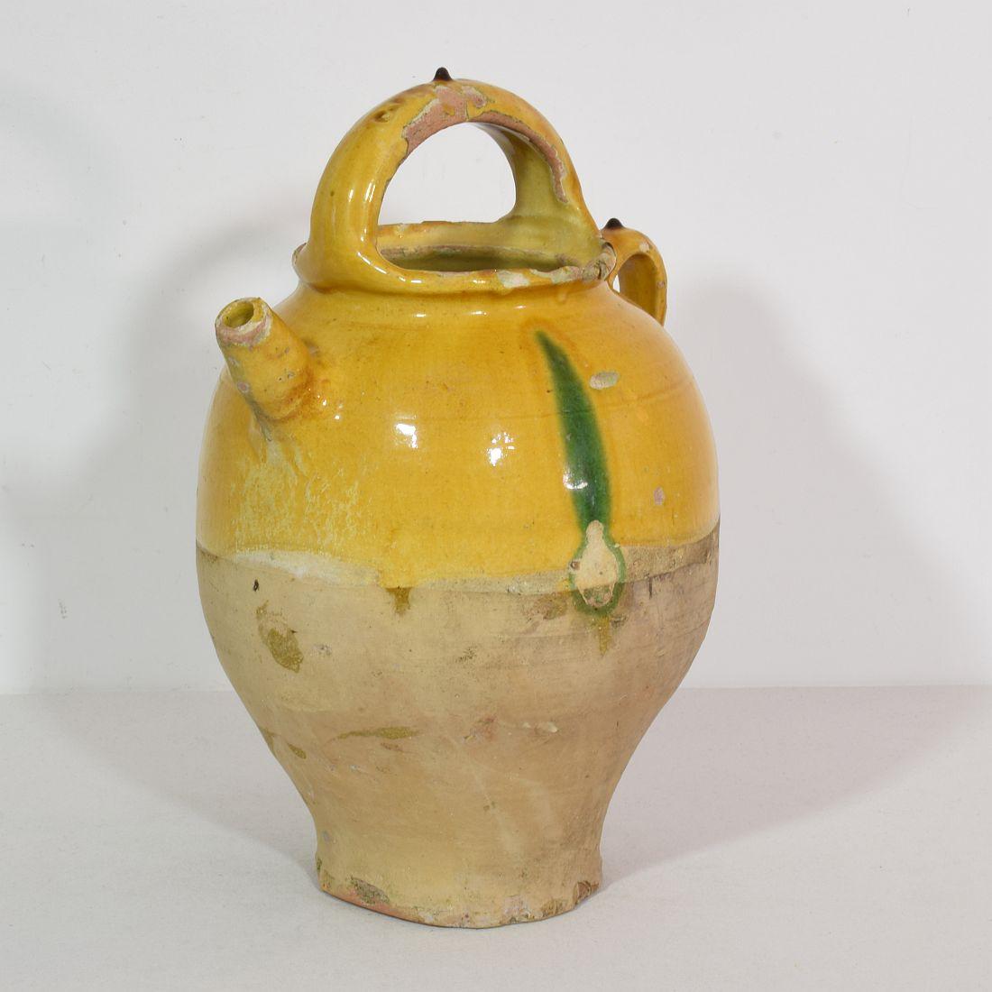 Great authentic and rare piece of pottery from the Provence. Beautiful weathered and an amazing color. Imperfections help authenticate this water cruche as it was an utilitarian type piece, France, circa 1850-1900.