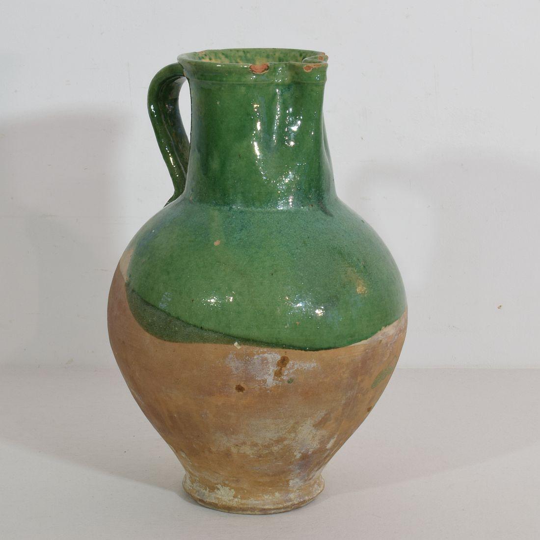 Great authentic and rare piece of pottery from the Provence. Beautiful weathered and an amazing color. Imperfections help authenticate this water cruche as it was a utilitarian type piece, France, circa 1850.