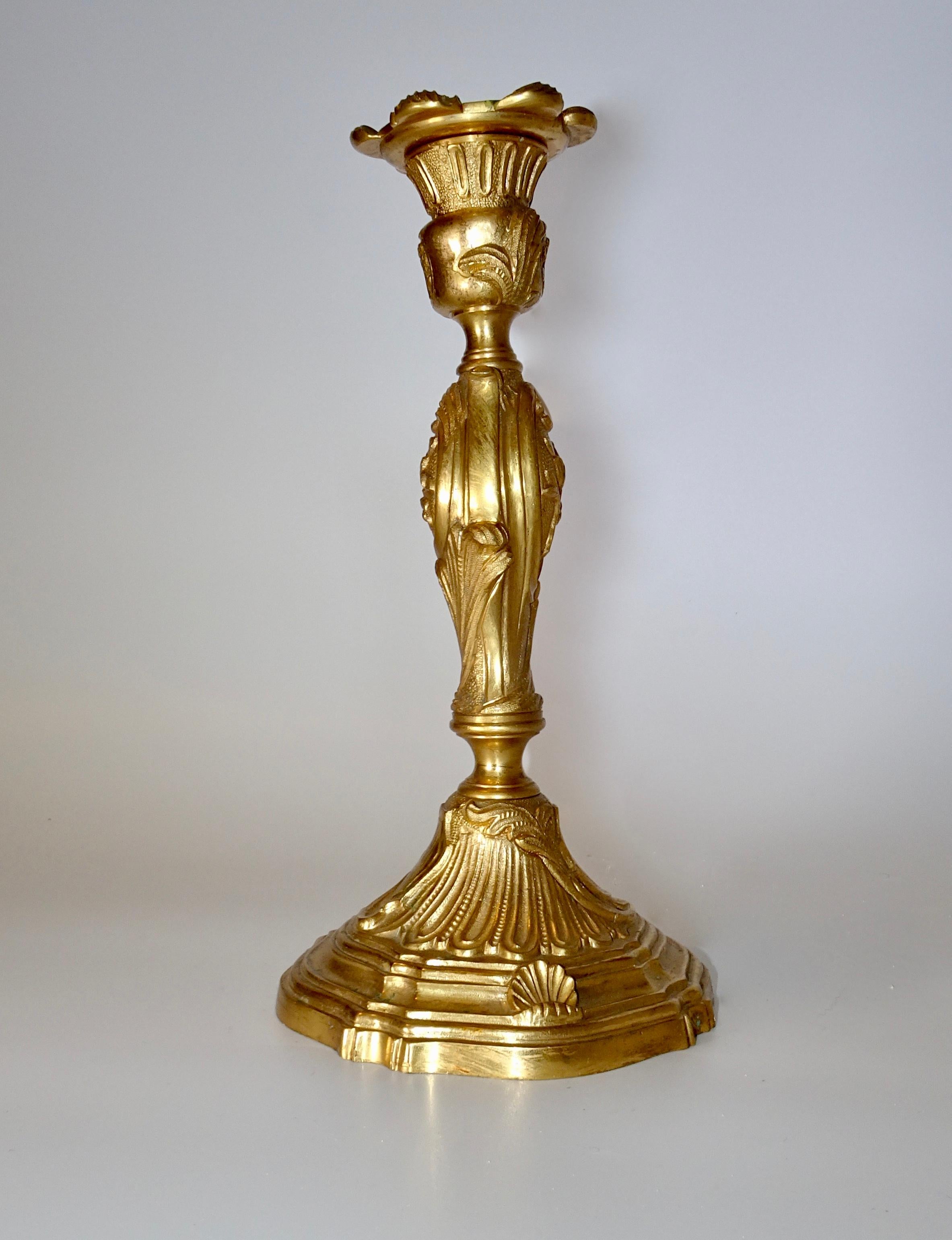 A single candlestick in gold doré in the French style.