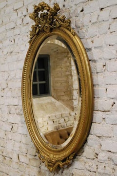 19th Century French Gold Gilt Oval Mirror with Bow and Arch