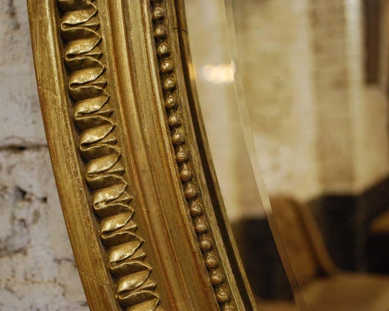 19th Century French Gold Gilt Oval Mirror with Bow and Arch at 1stDibs