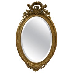 19th Century French Gold Gilt Oval Mirror with Bow and Arch