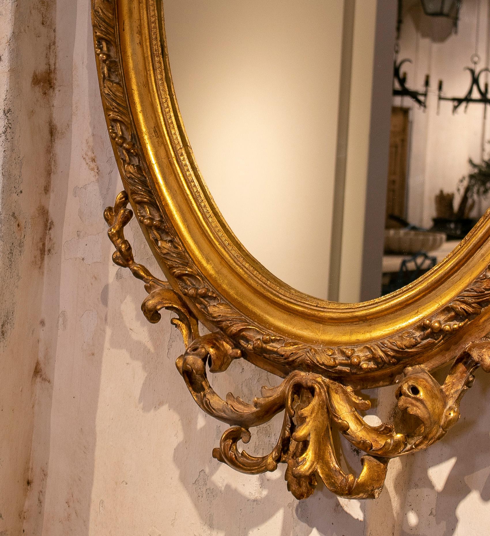 19th Century French Gold Giltwood Oval mirror w/ Crest & Baroqe Rocaille  For Sale 15