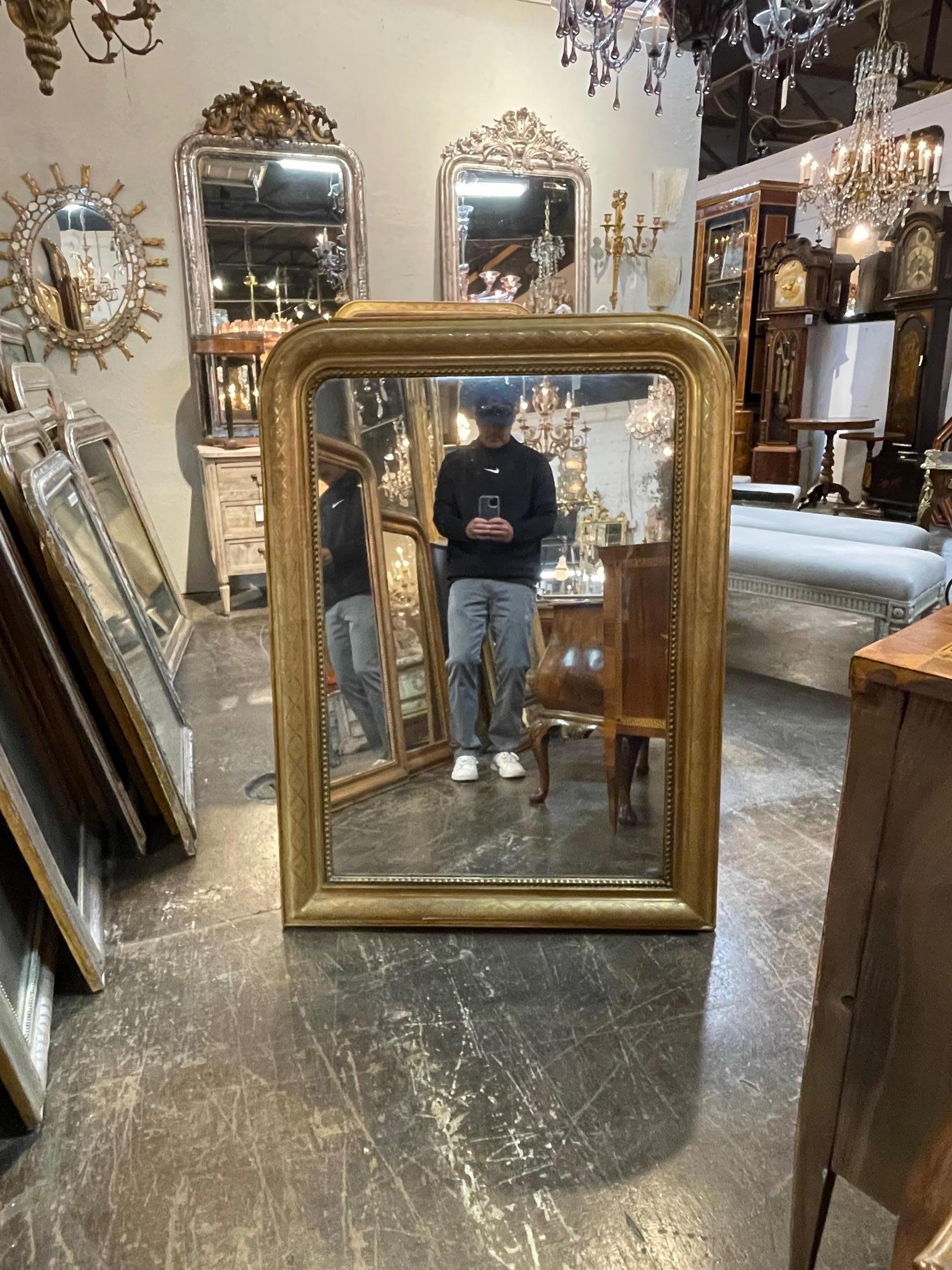 Exceptional gold gilt Louis Philiippe mirror with X pattern and beaded inner border. Beautiful golf leaf patina on this one as well. A real beauty!!