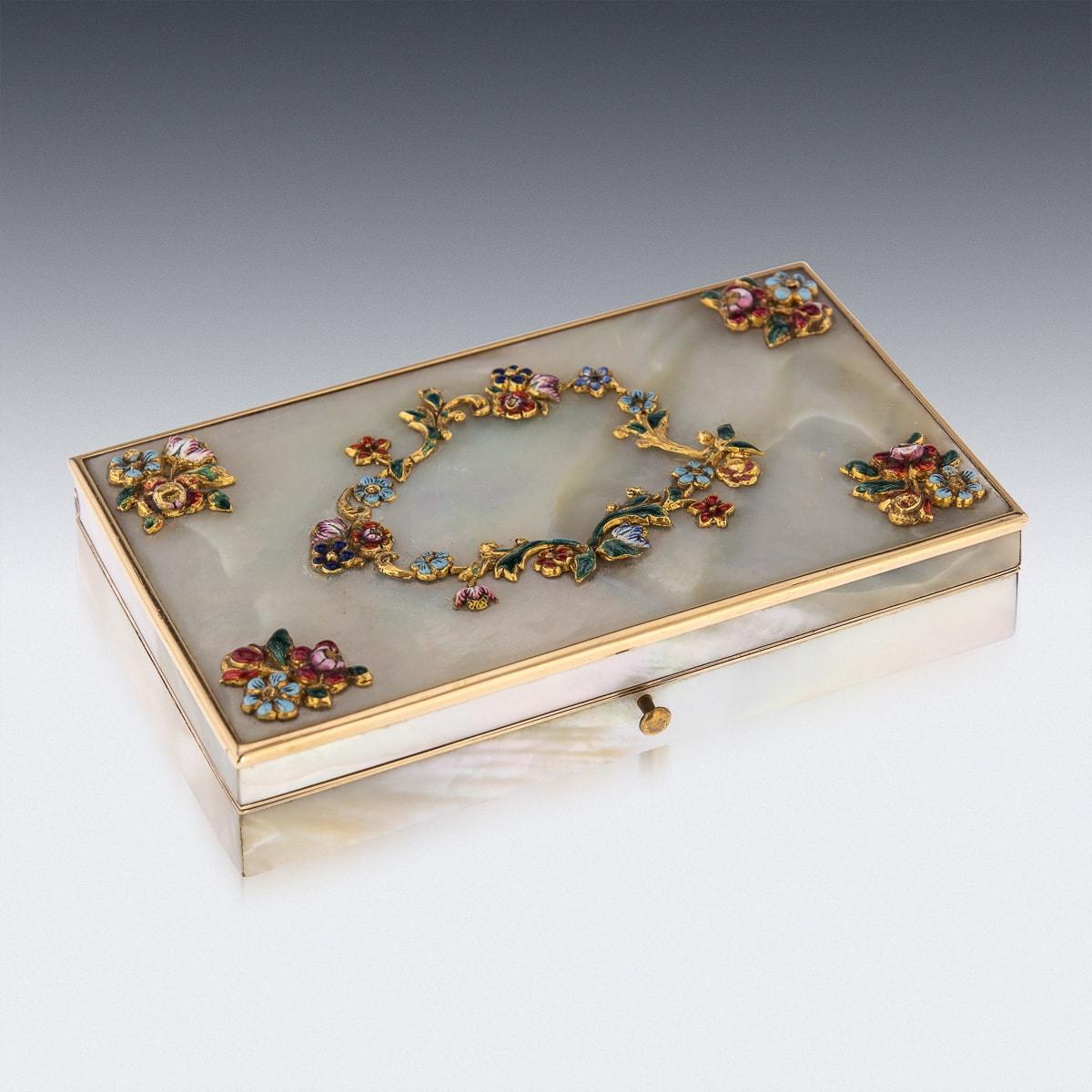 Antique 19th Century French gold mounted on mother of pearl, extensive traveling etui set, of elongated octagonal form, the gold mounted with polished mother of pearl panels and the lid applied with cast and enamelled floral decoration, the lid